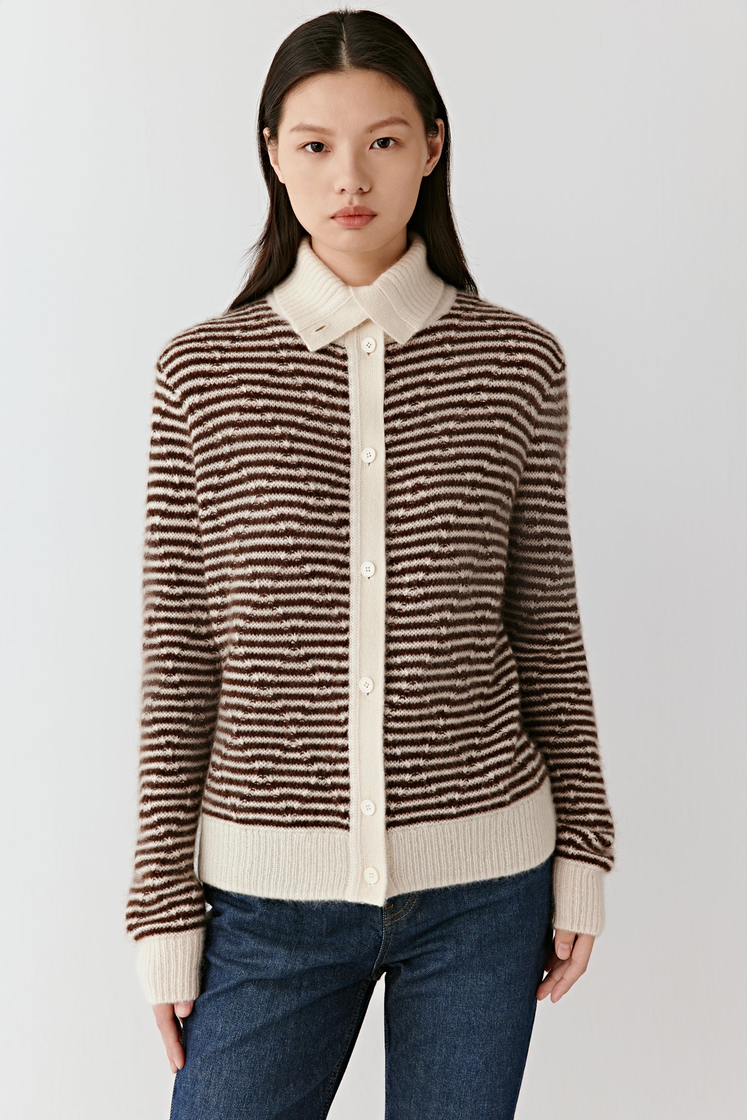 Front view showing the striped cashmere-silk cardigan’s button placket, fitted shape, and soft knit texture.