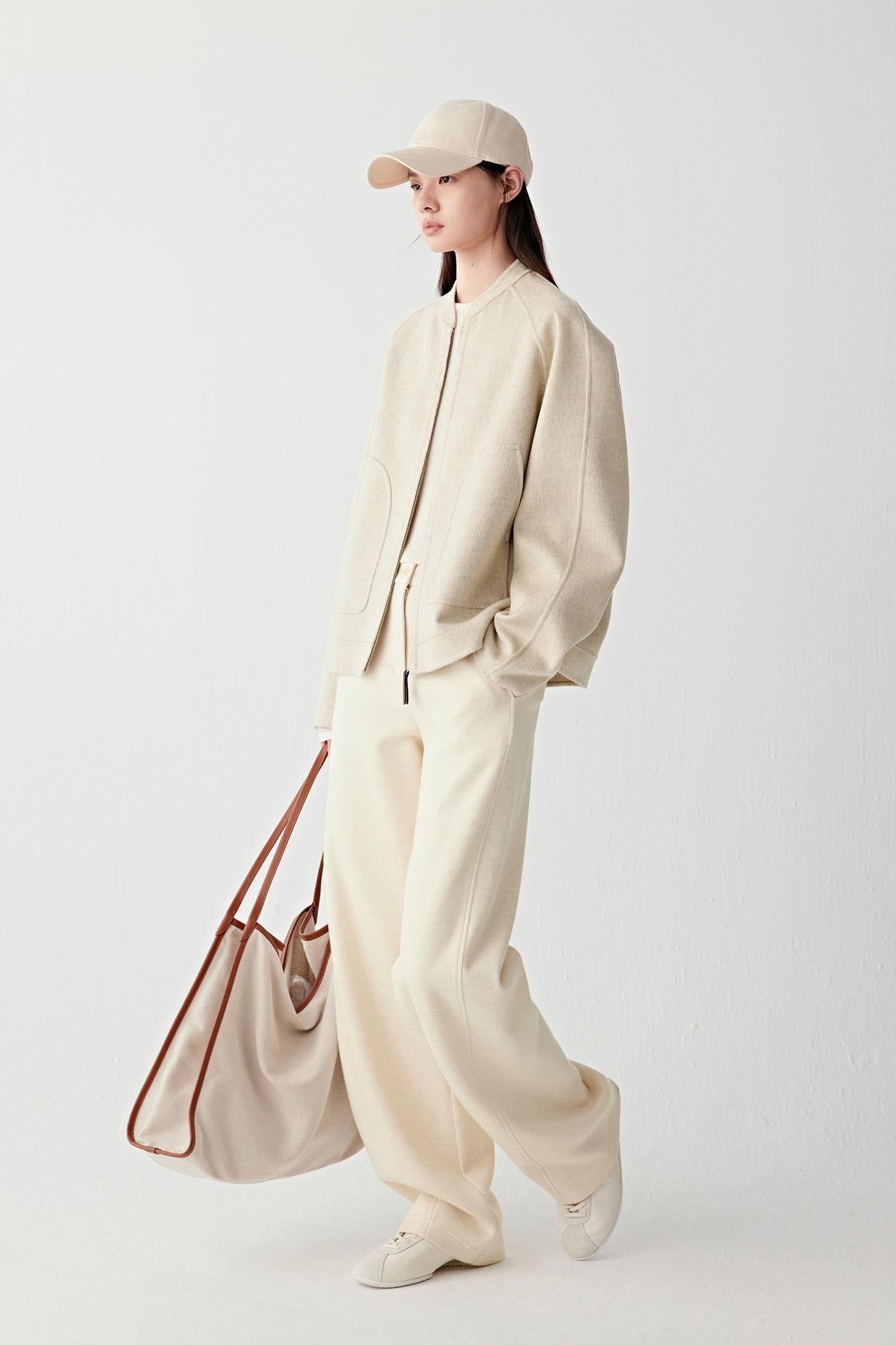 Close-up of the sleeve and cuff, revealing the thickness and soft edge of the double-faced construction.