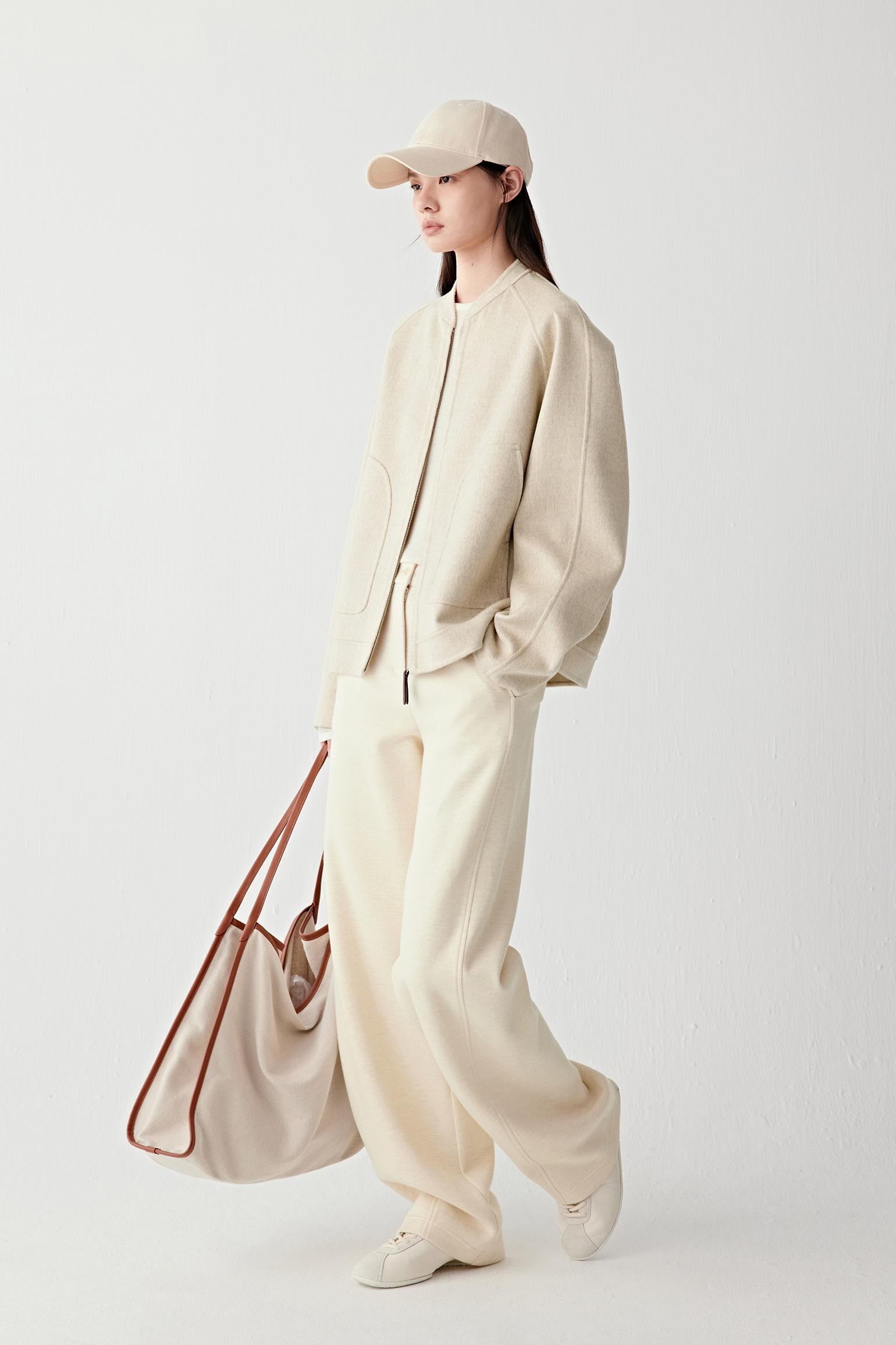 Close-up of the sleeve and cuff, revealing the thickness and soft edge of the double-faced construction.