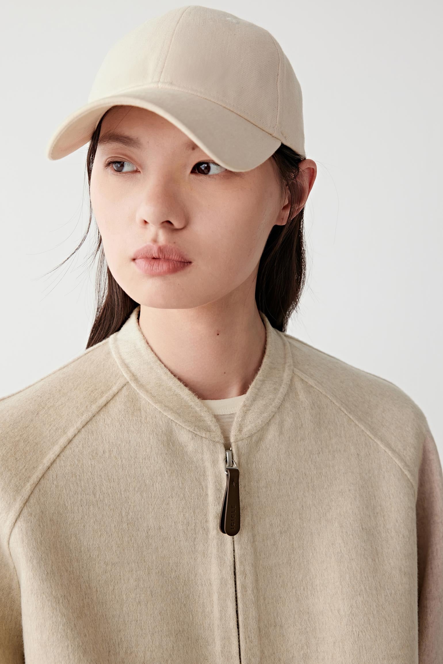 Close-up of the hem and fabric texture, emphasizing the natural fibres and brushed finish.