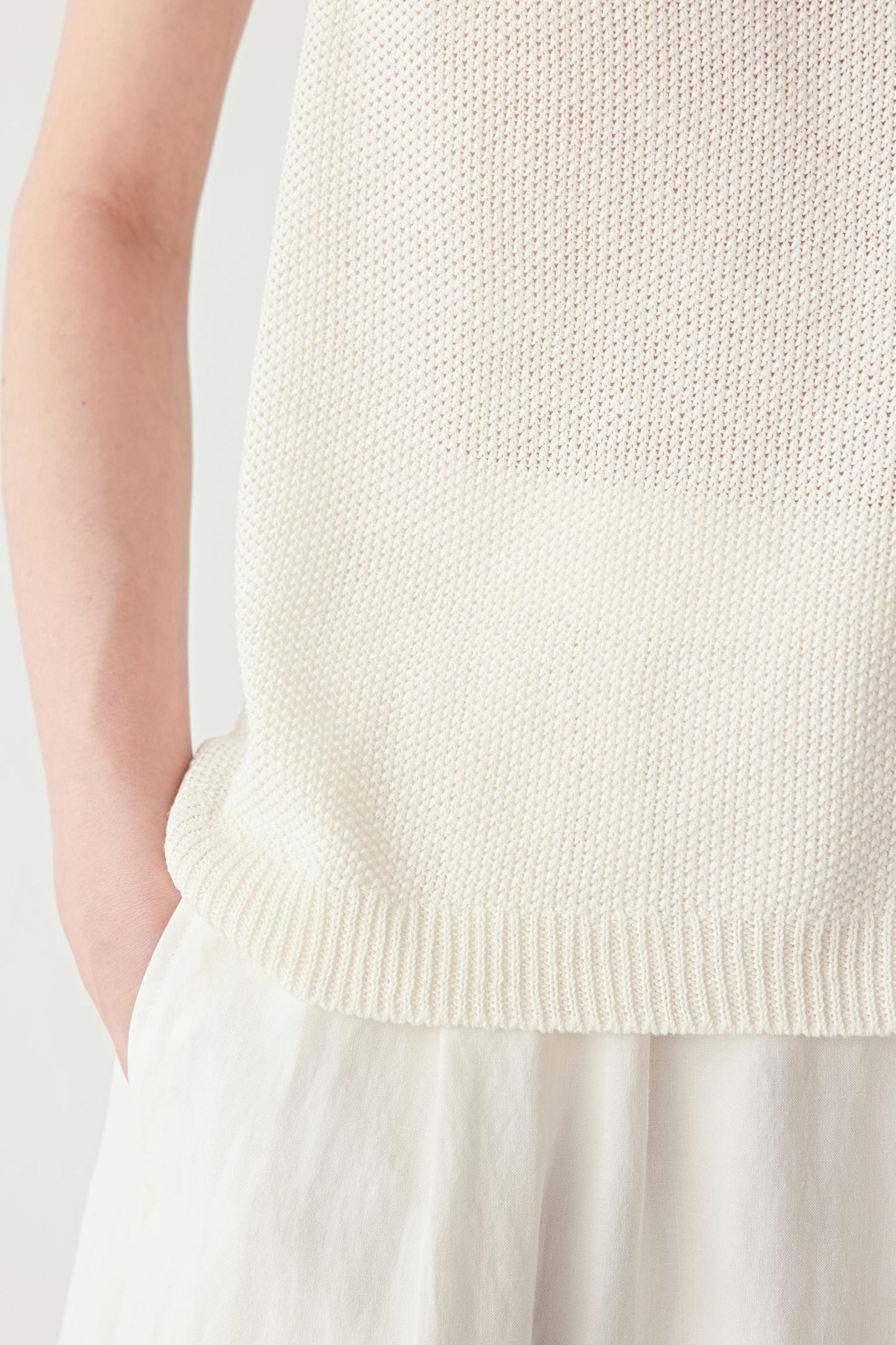 Close-up of hem showing knit density, transparency and soft structure