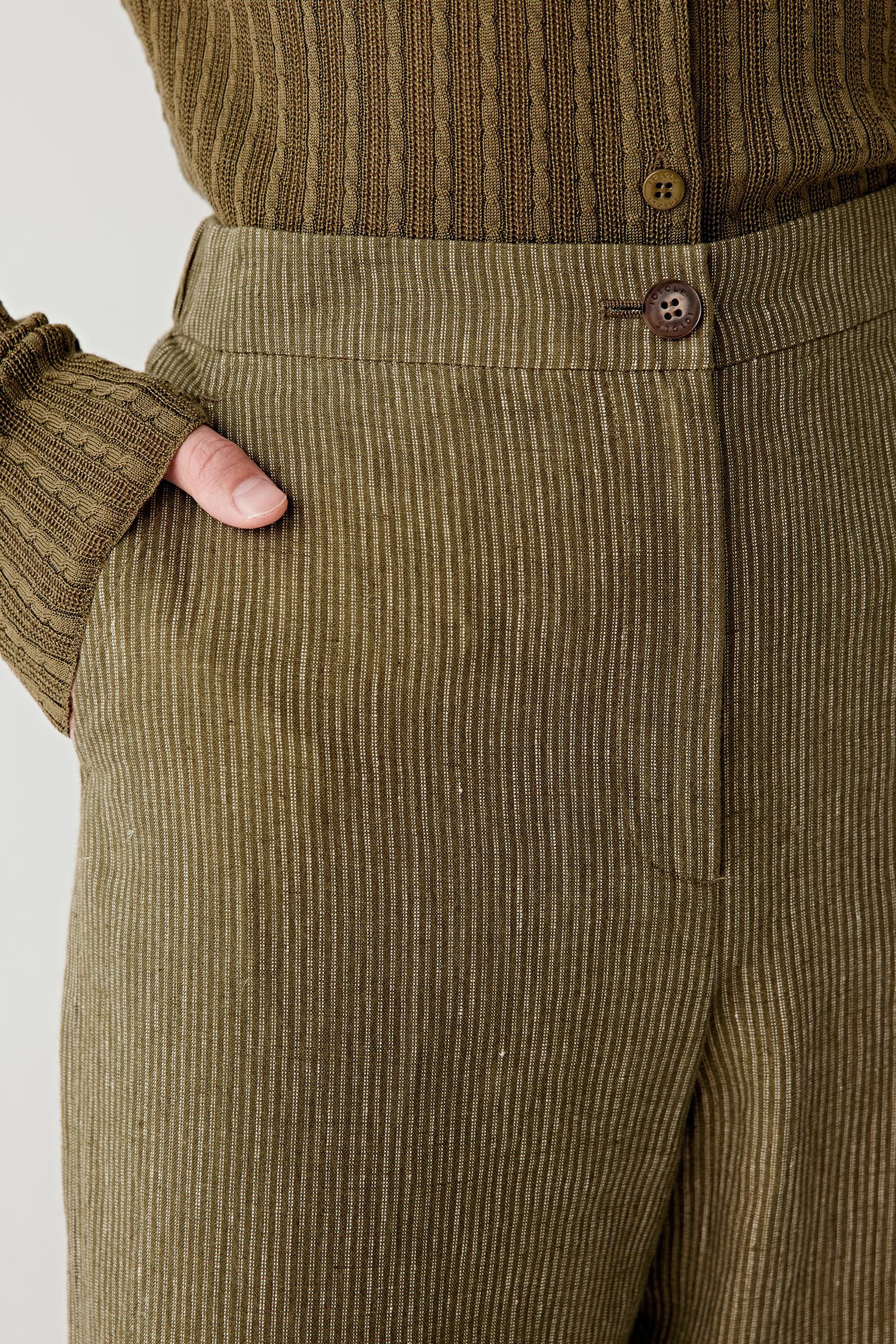 Close-up of waistband and pocket showing stitching, construction and textured weave