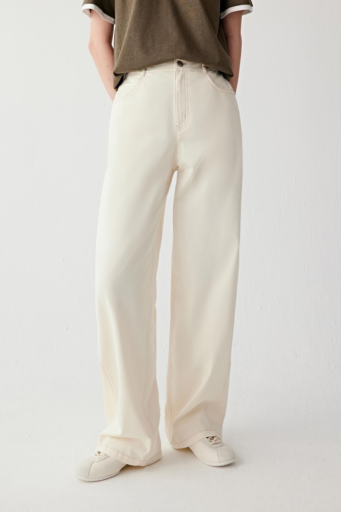 Side view emphasizing straight leg, clean line from waist to hem and fabric density