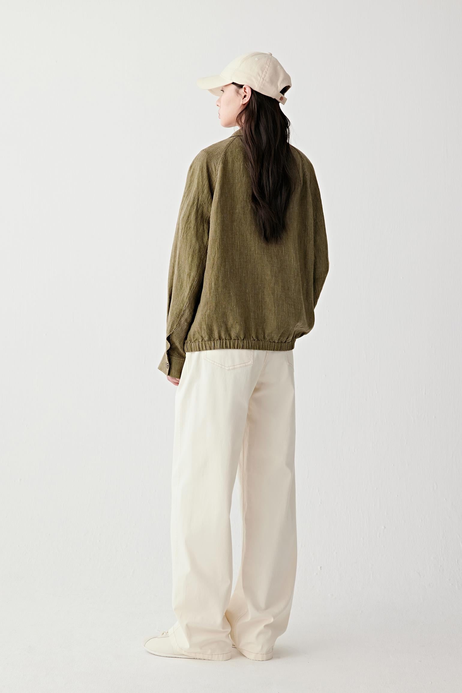 Full-length back view emphasizing straight cut, natural fall and subtle fabric irregularities