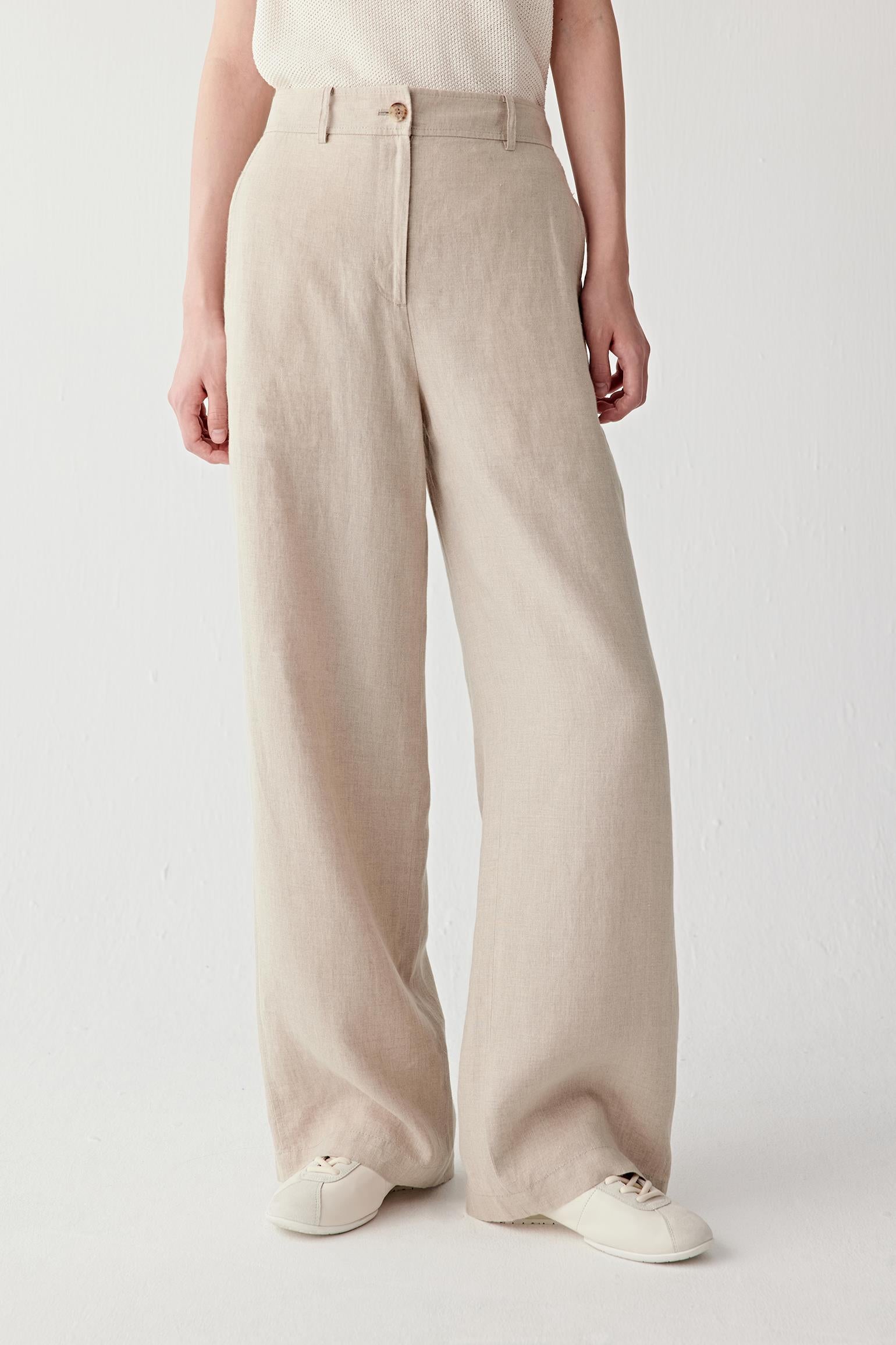 Front view focusing on the straight wide-leg silhouette and high waist construction, emphasizing the fluid movement and airy structure of the linen fabric