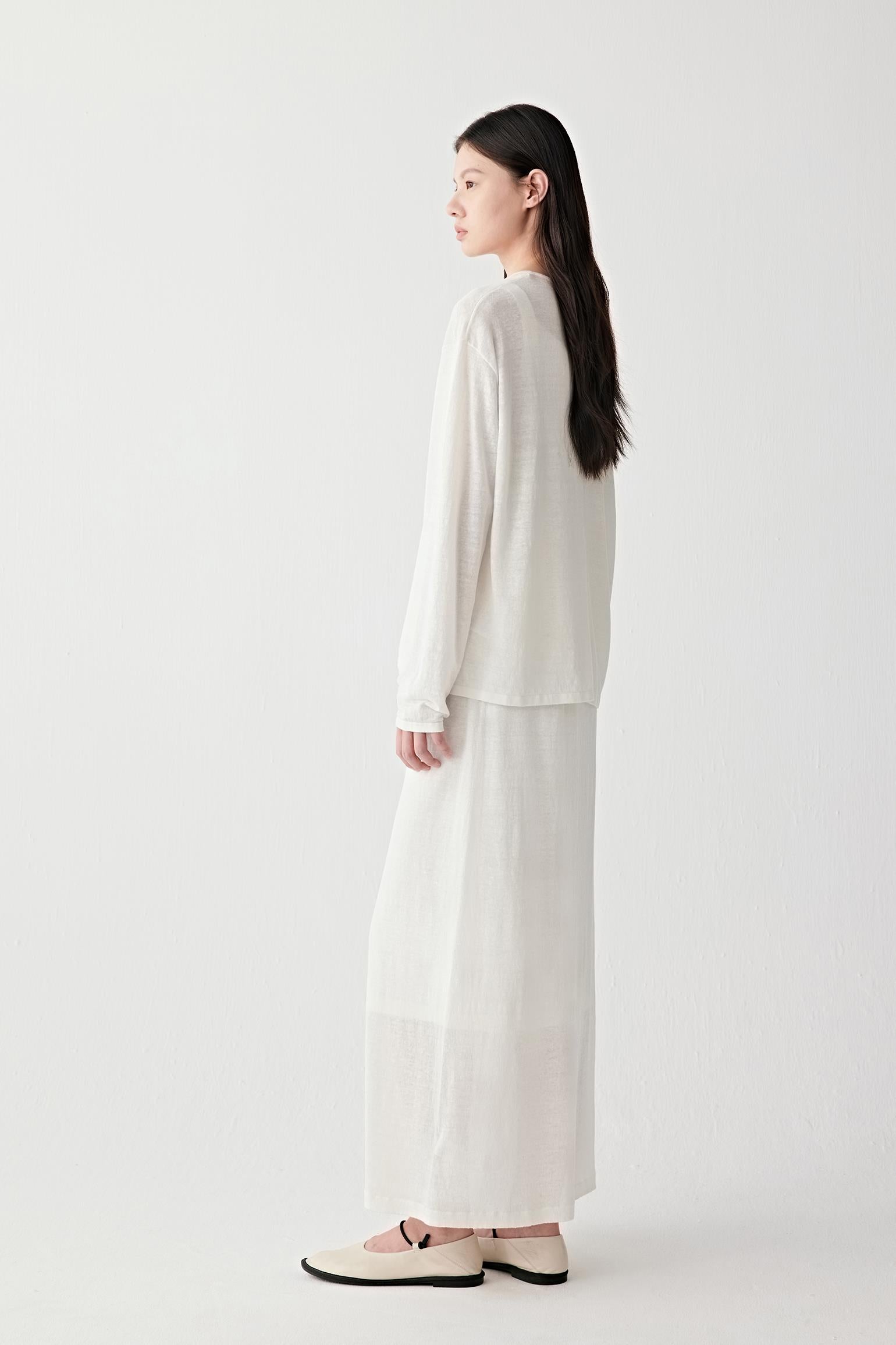 Full-length side or back view highlighting the elongated silhouette and airy drape created by the lightweight linen and nylon blend