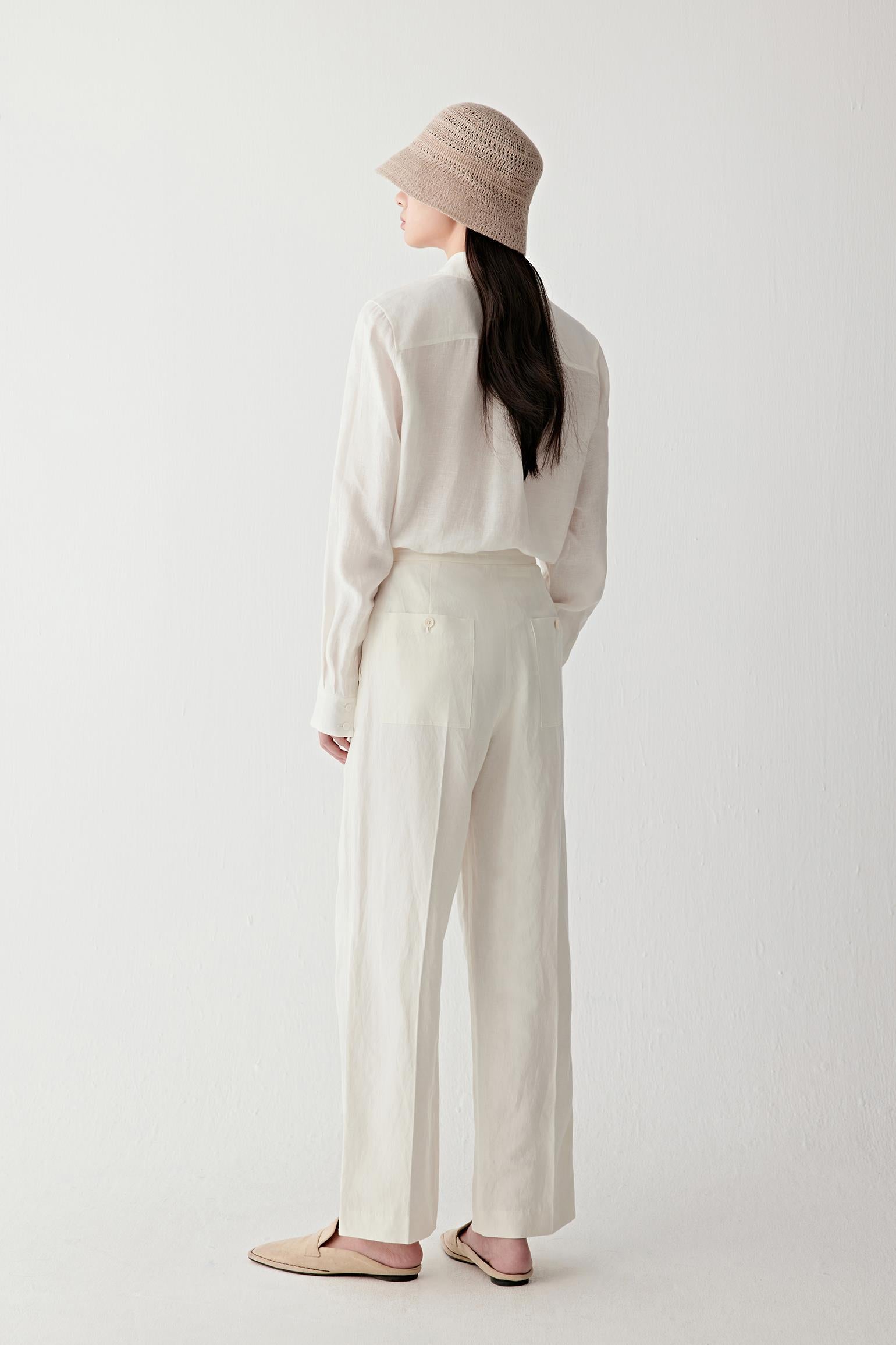 Full-length side or back view highlighting the relaxed straight cut and fluid drape through the body and sleeves
