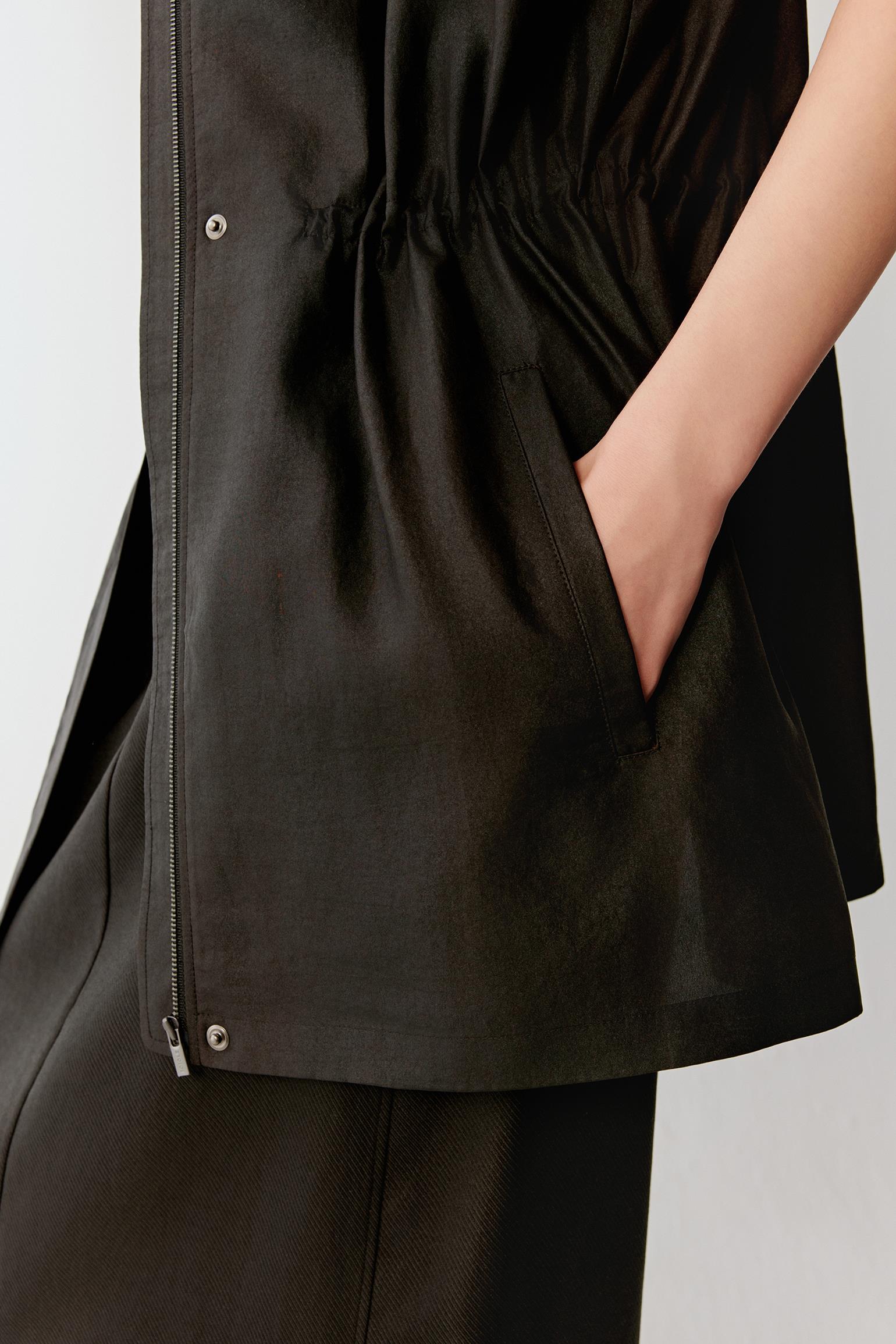 Close-up of side pocket and waist detailing the drawstring construction, visible stitching and fluid texture of the lightweight Gambiered Canton Gauze fabric