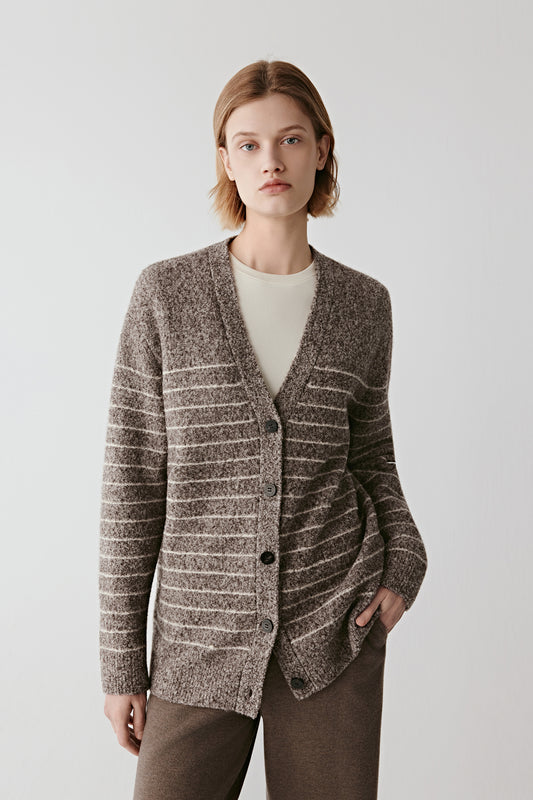 Front view of a striped wool and yak cardigan in natural brown and off-white tones, featuring a V neckline and tonal button placket.