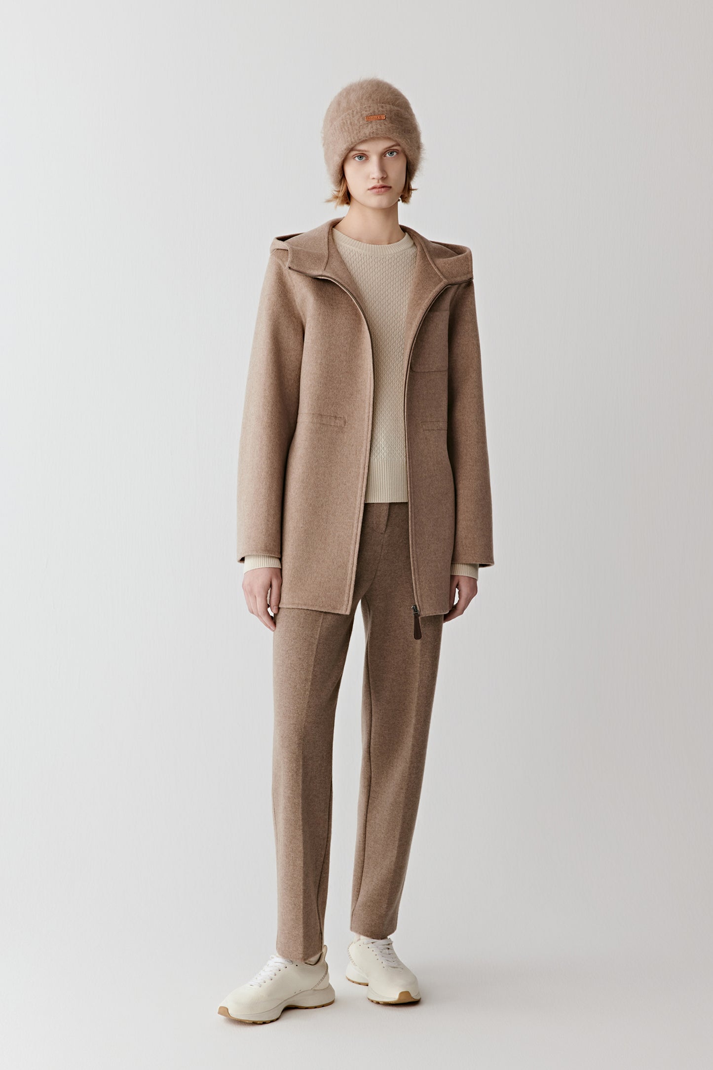 Full-length front view of straight trousers in double-faced wool and cashmere jersey in a natural taupe shade.