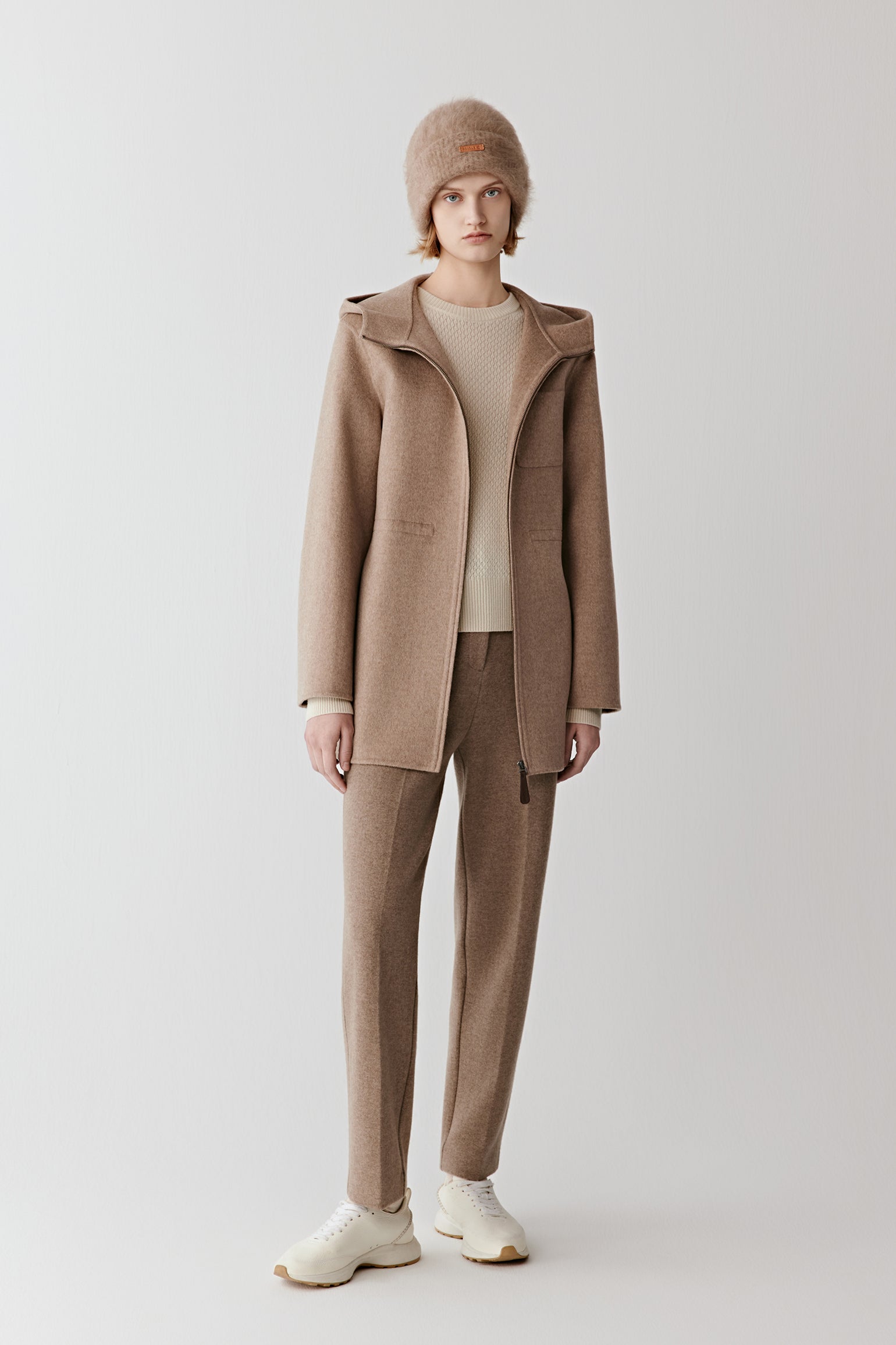 Full-length front view of straight trousers in double-faced wool and cashmere jersey in a natural taupe shade.