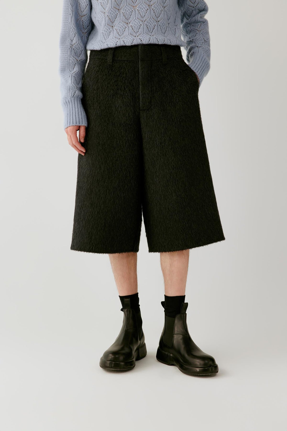 Front view highlighting the wide-leg silhouette, below-the-knee length and structured drape of the anthracite melange camel and mohair shorts.