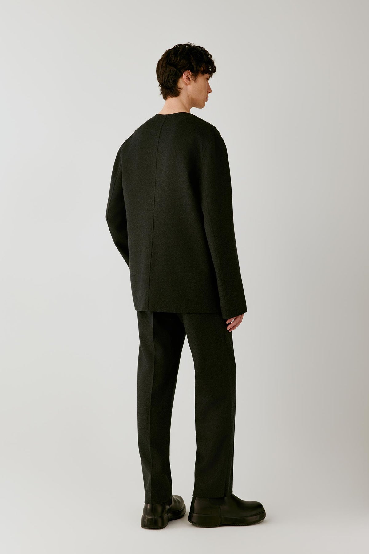Full-length back view highlighting the clean back construction and dropped shoulders.