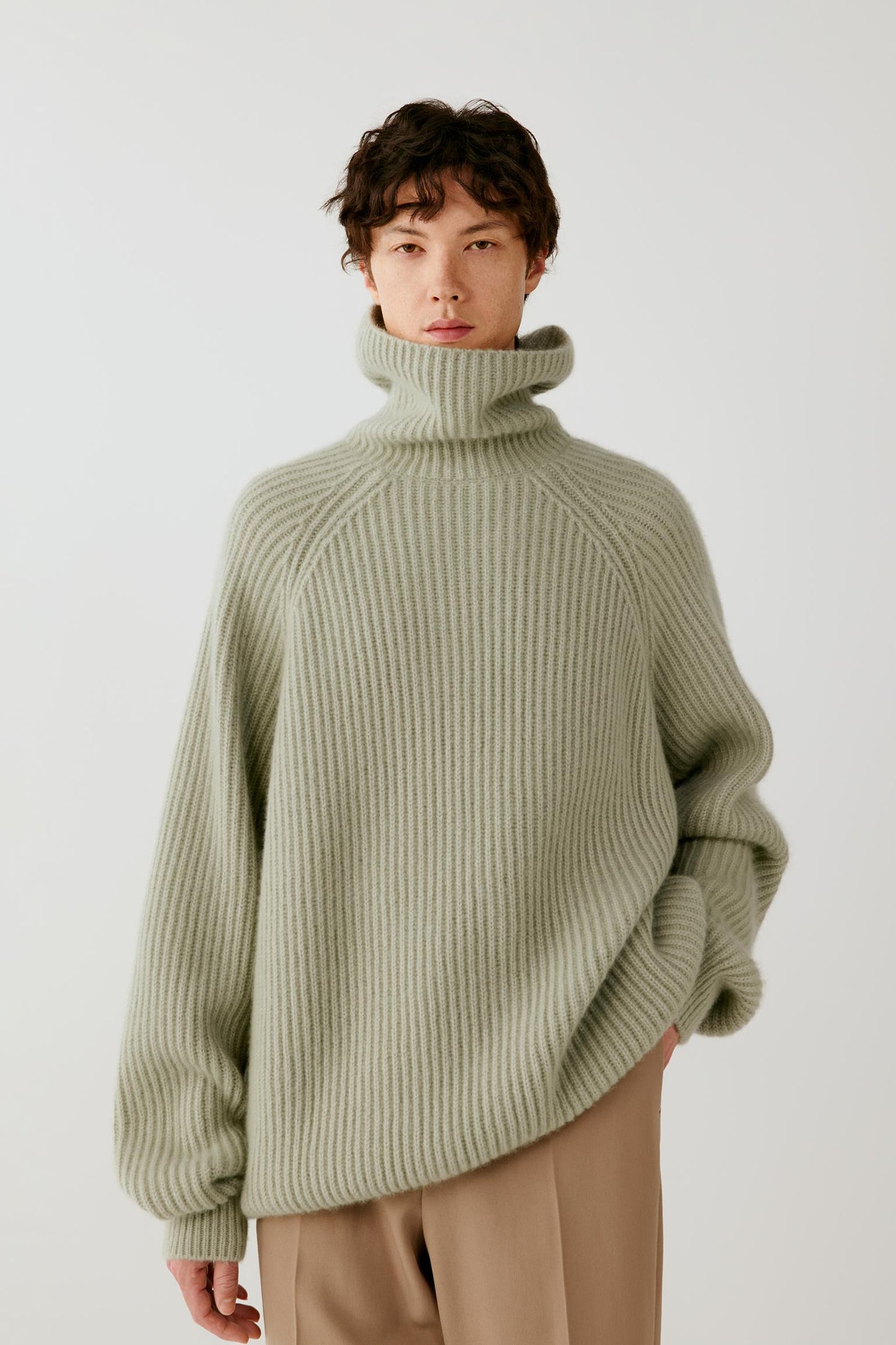 Front view highlighting the dropped shoulders, raglan sleeves and relaxed silhouette.