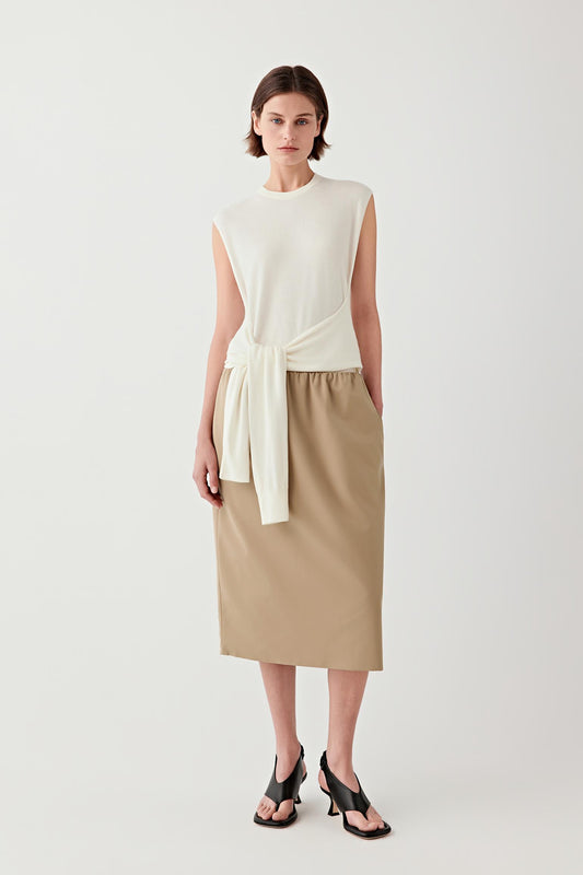 Full-length view showing the straight cut and clean armholes.