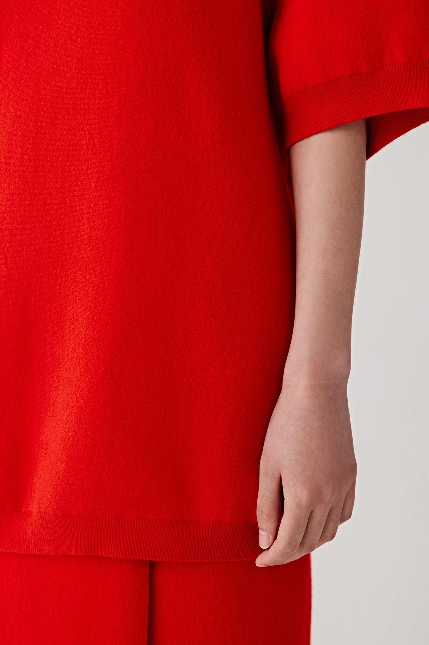 Red outfit with a plain background