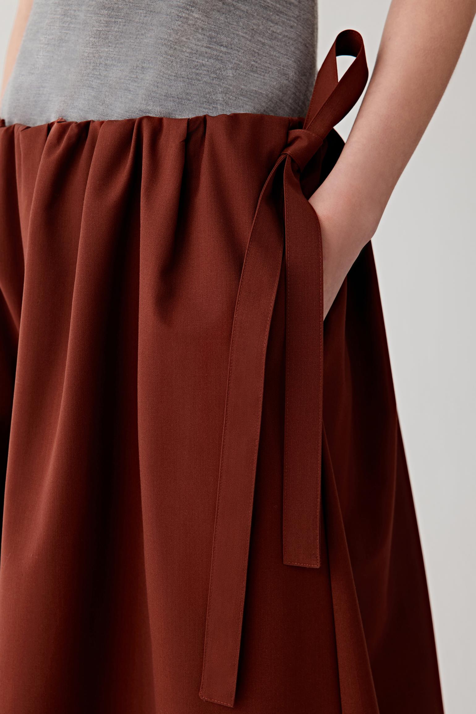 Close-up of the waistband with side ties.