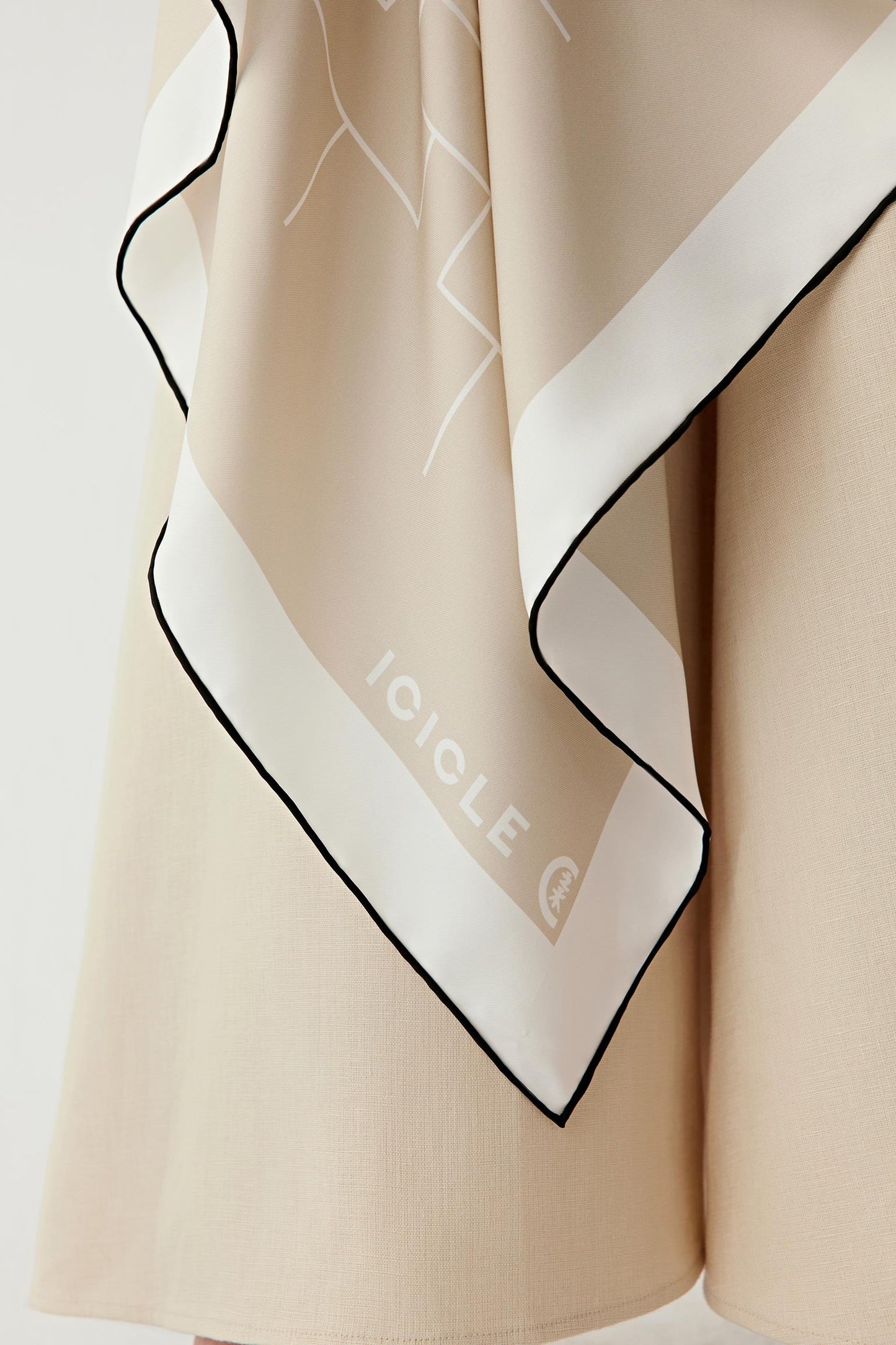 Close-up of the silk twill texture and clean finished edges.