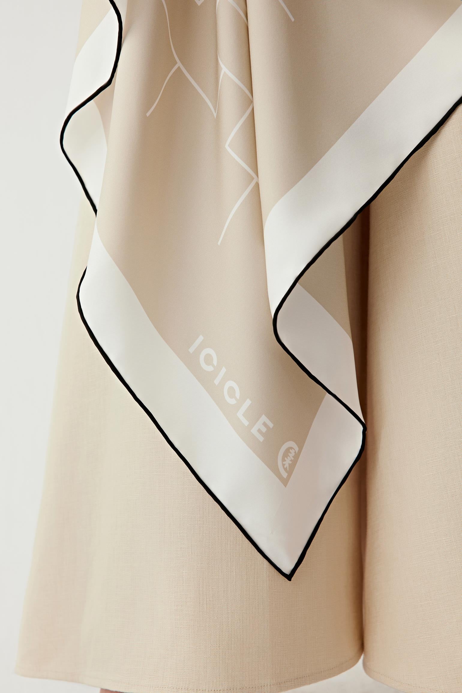 Close-up of the silk twill texture and clean finished edges.