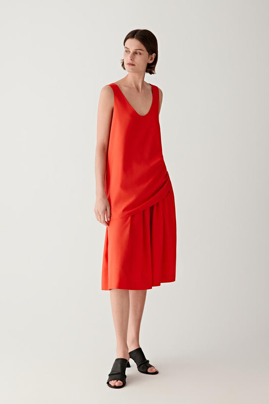 Full-length front view emphasizing the straight silhouette and scoop neckline, showing the soft movement of the silk poplin fabric