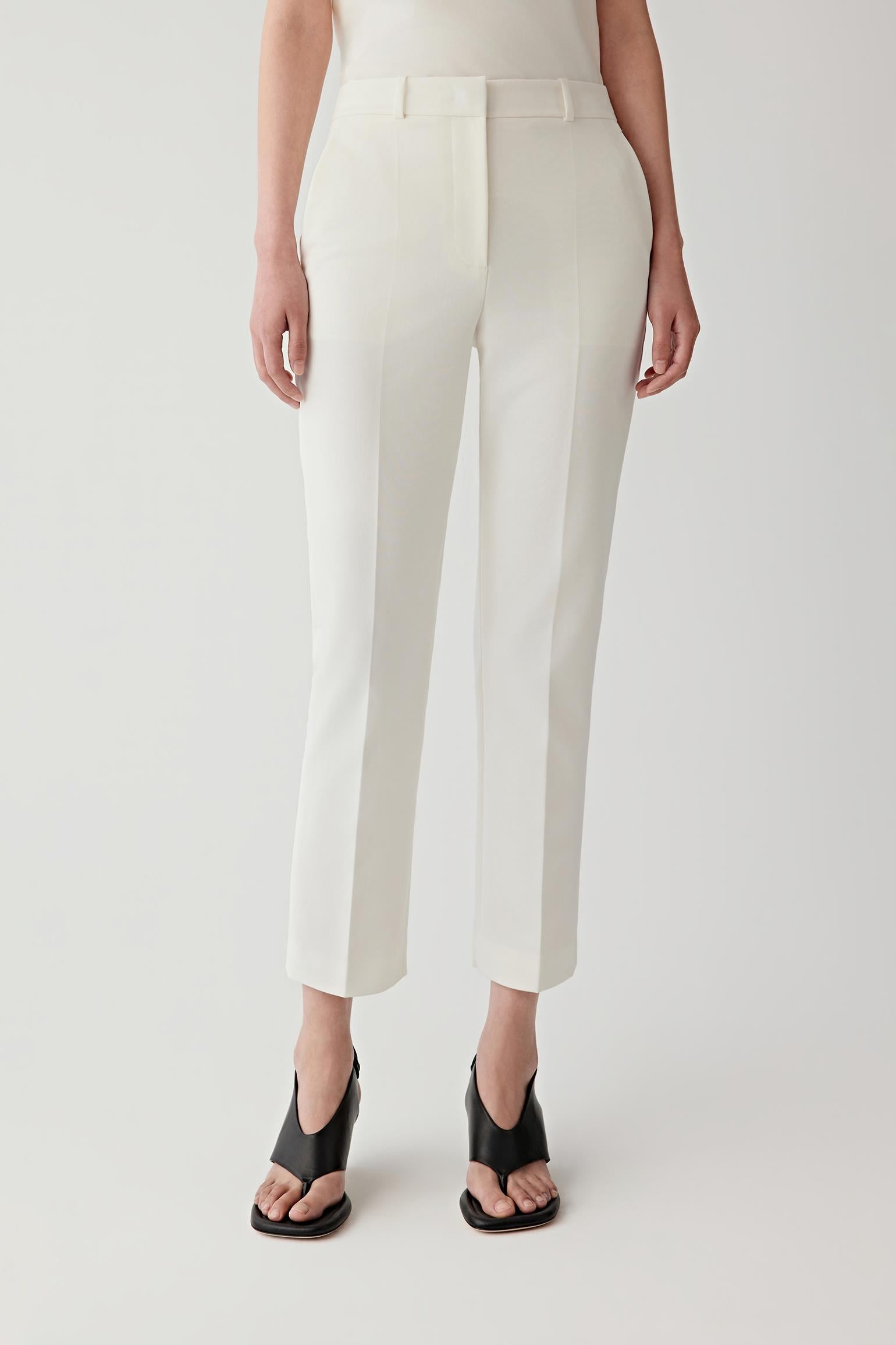 Front view of the white bootcut trousers.