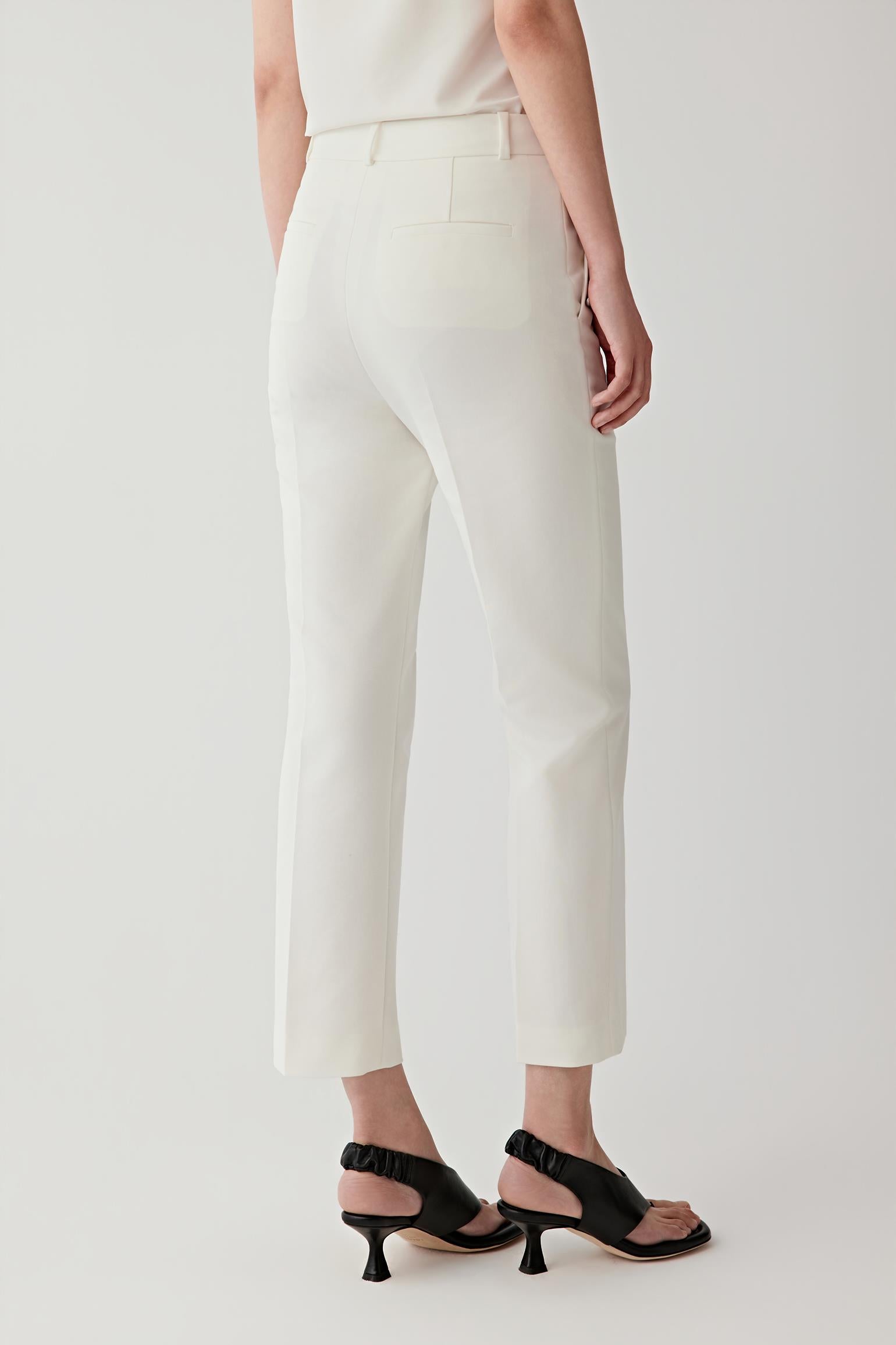 Side view highlighting the tailored fit and flared leg.