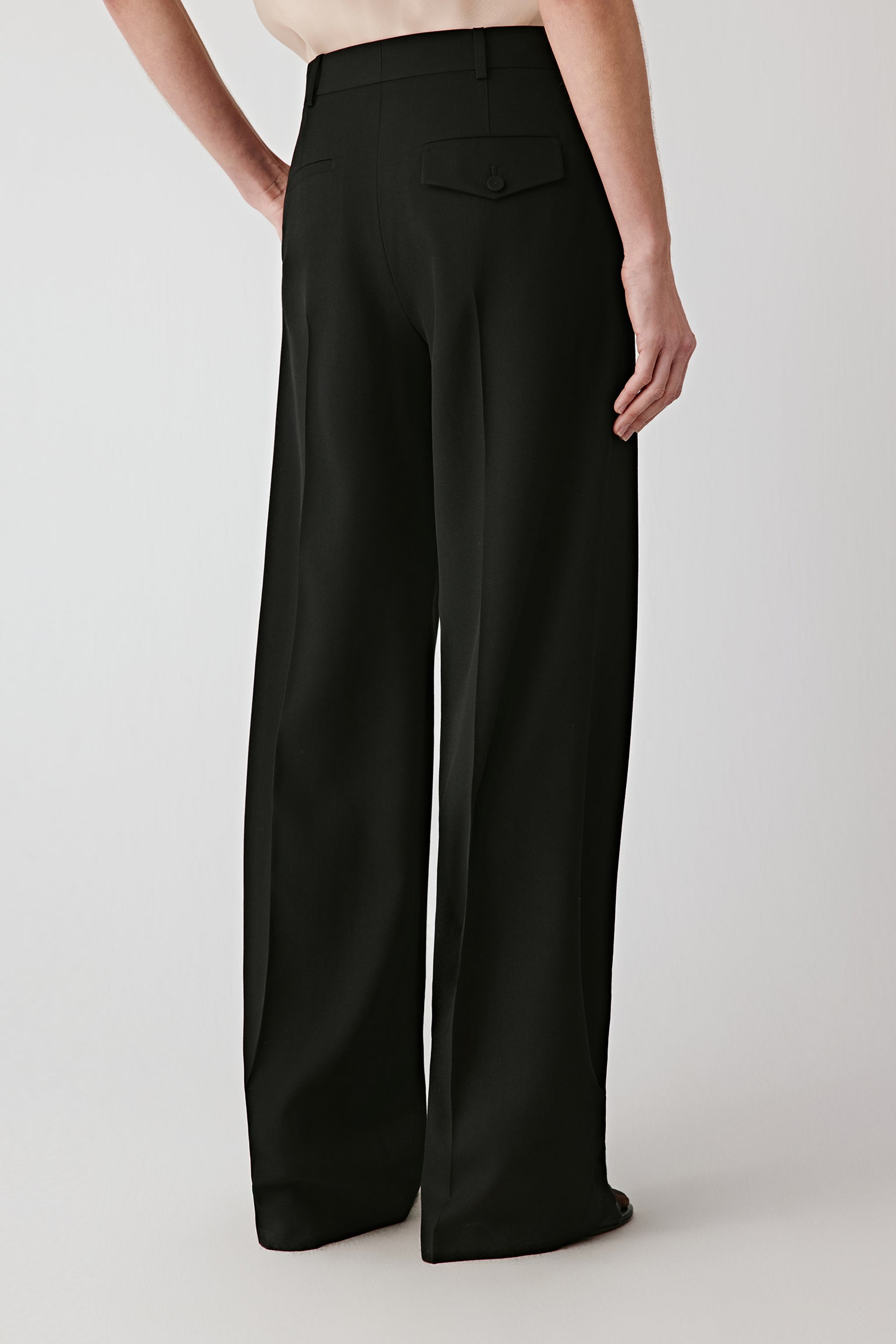 Back view highlighting the wide-leg cut and fluid movement.