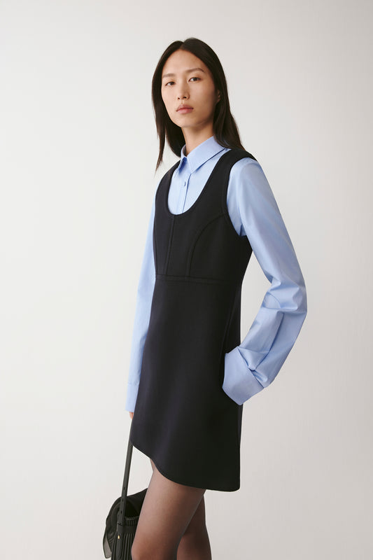 Three-quarter front view highlighting the clean lines and defined waist seam.