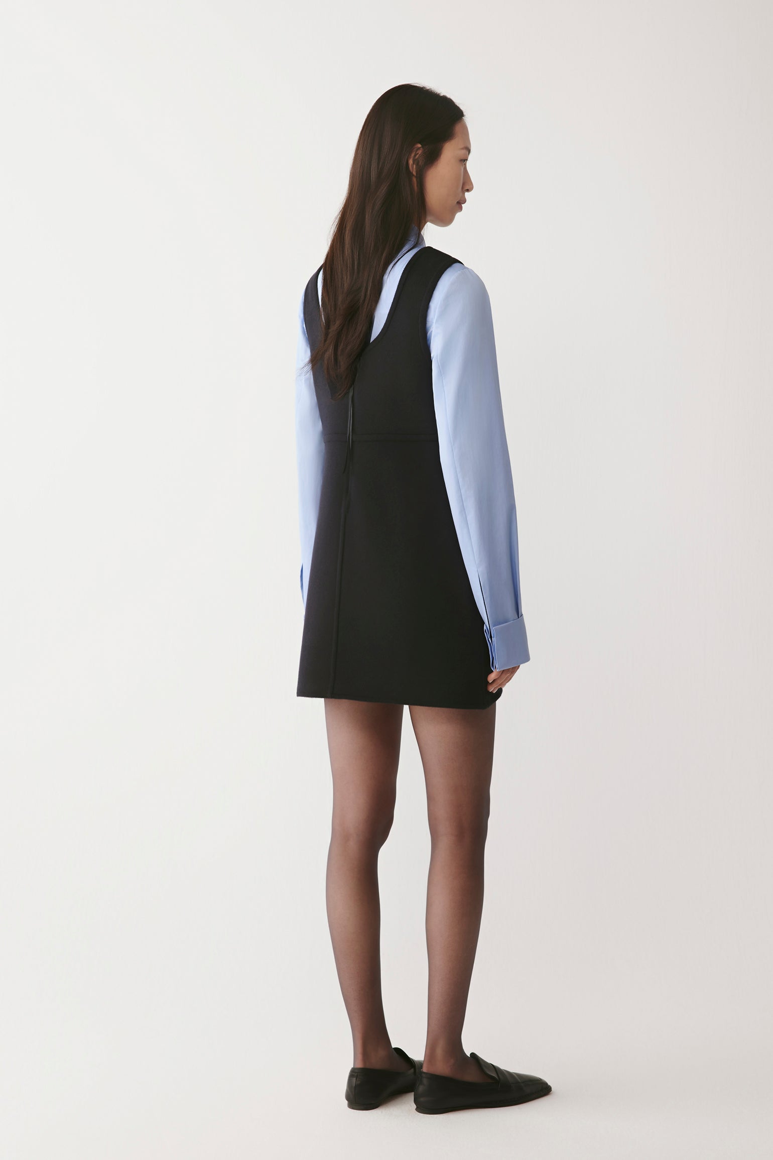 Back view revealing the straight fall and minimalistic design.