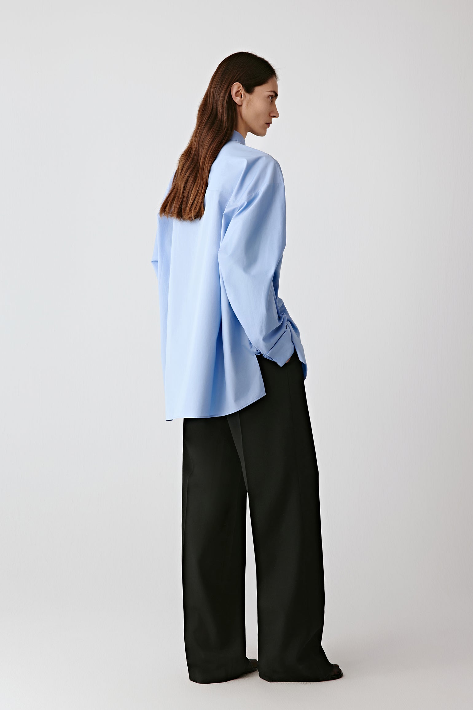 Side view showing the fluid drape and relaxed fit.