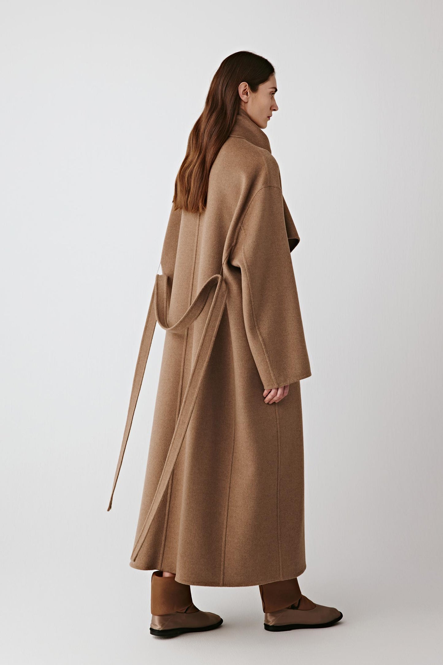 Side view showing the fluid drape and natural movement of the fabric.