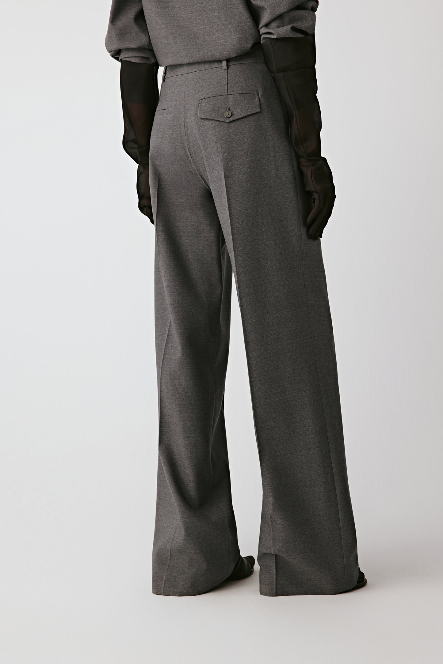 Back view highlighting the fluid, wide-leg silhouette.