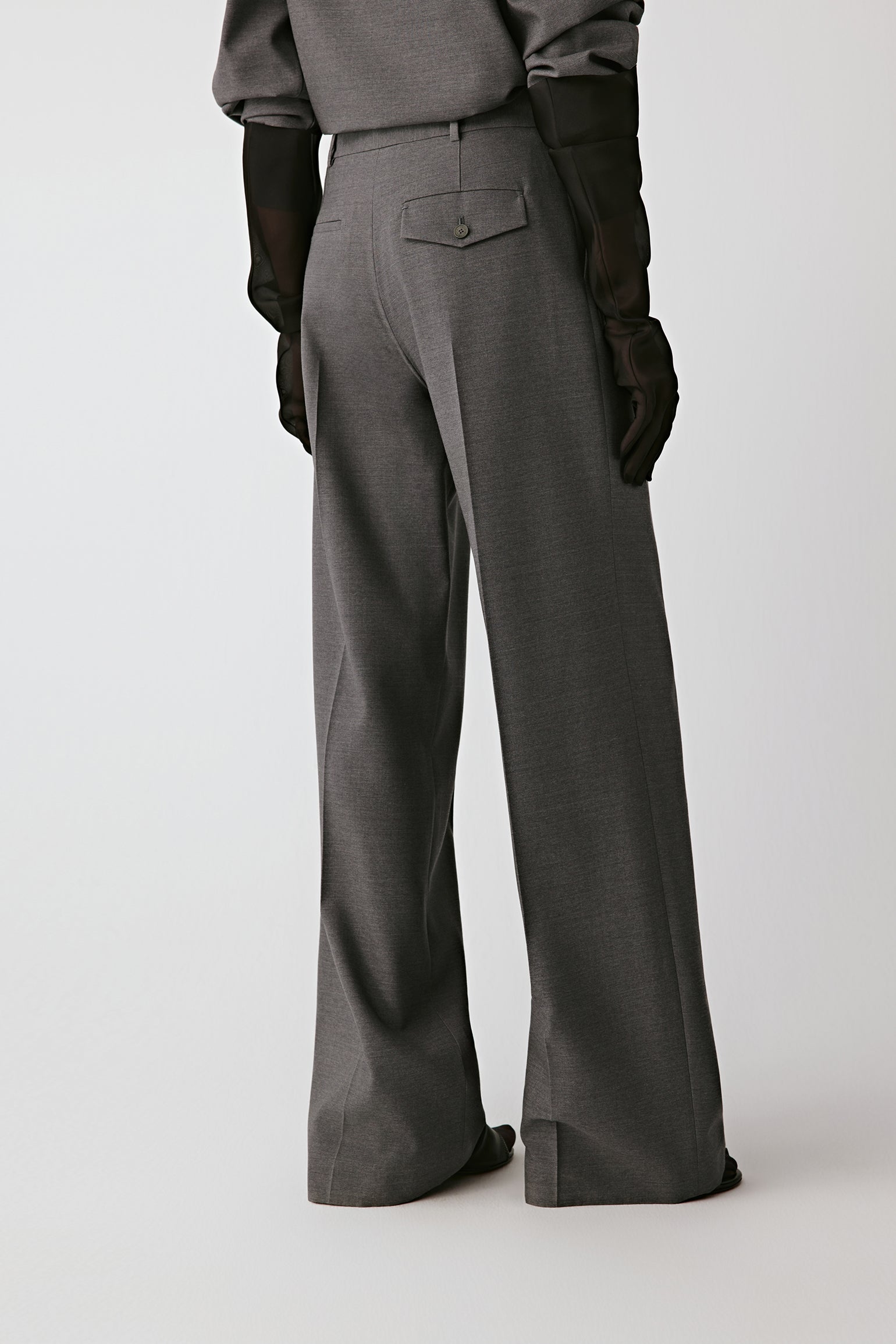 Back view highlighting the fluid, wide-leg silhouette.