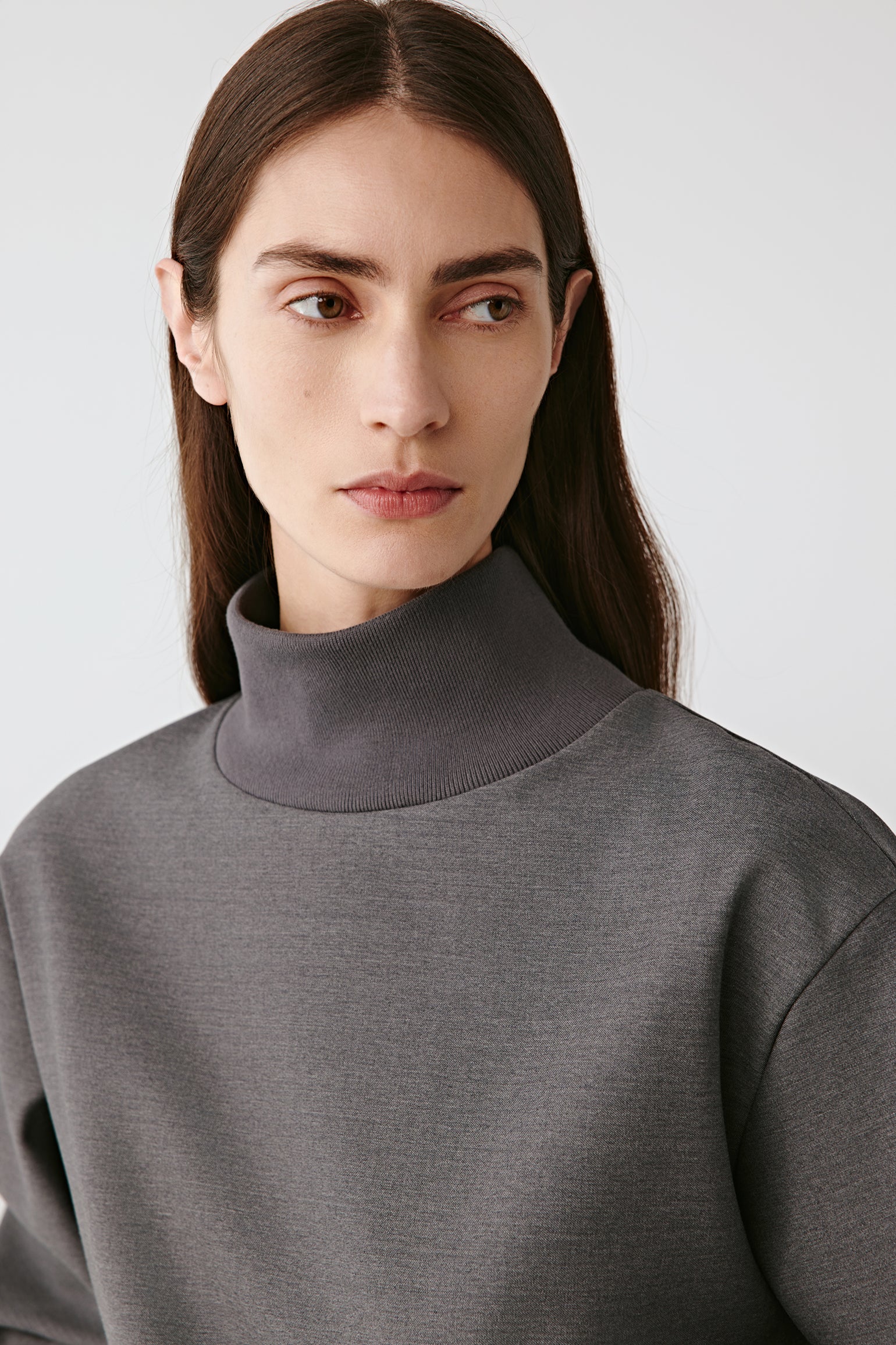 Close-up of the collar and shoulder area, showing the refined finishing and luxurious fabric texture.