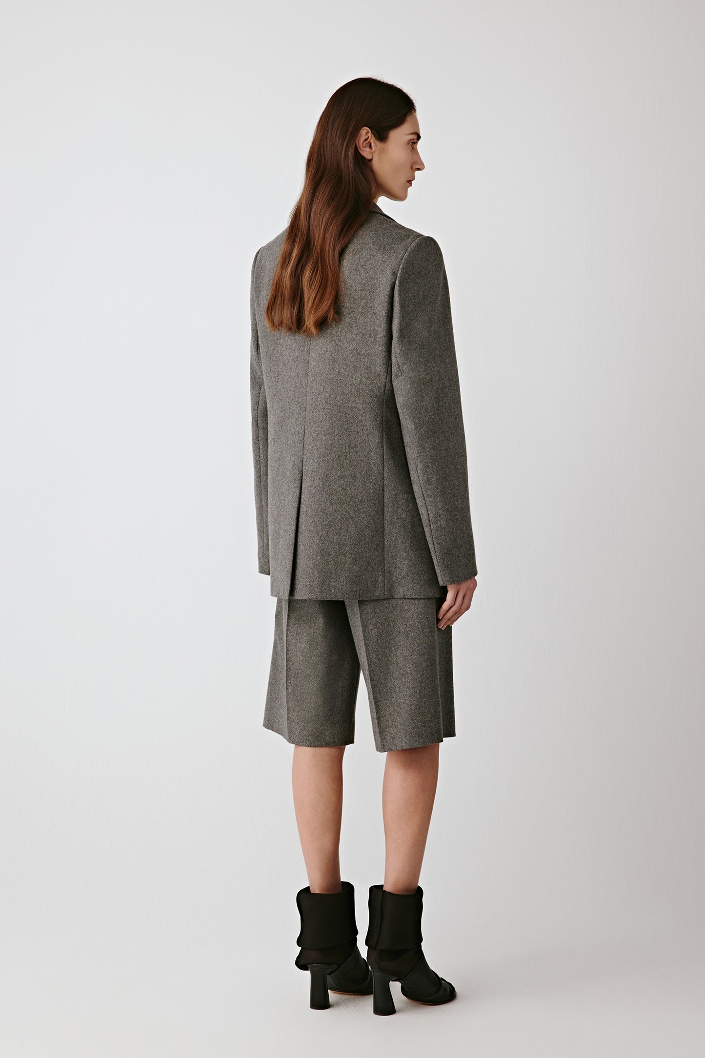 Back view showing smooth drape and straight fit.