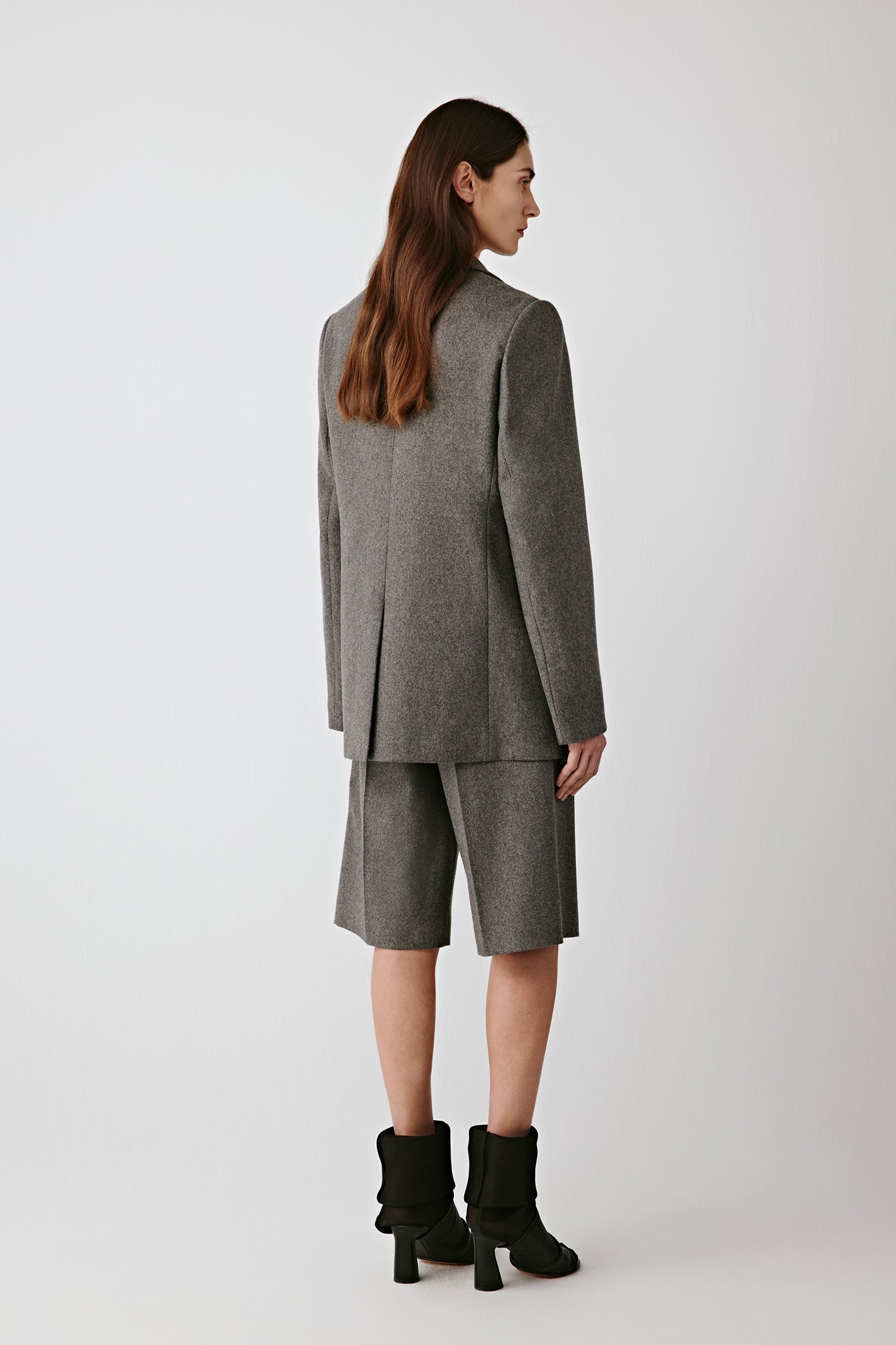 Back view showing smooth drape and straight fit.