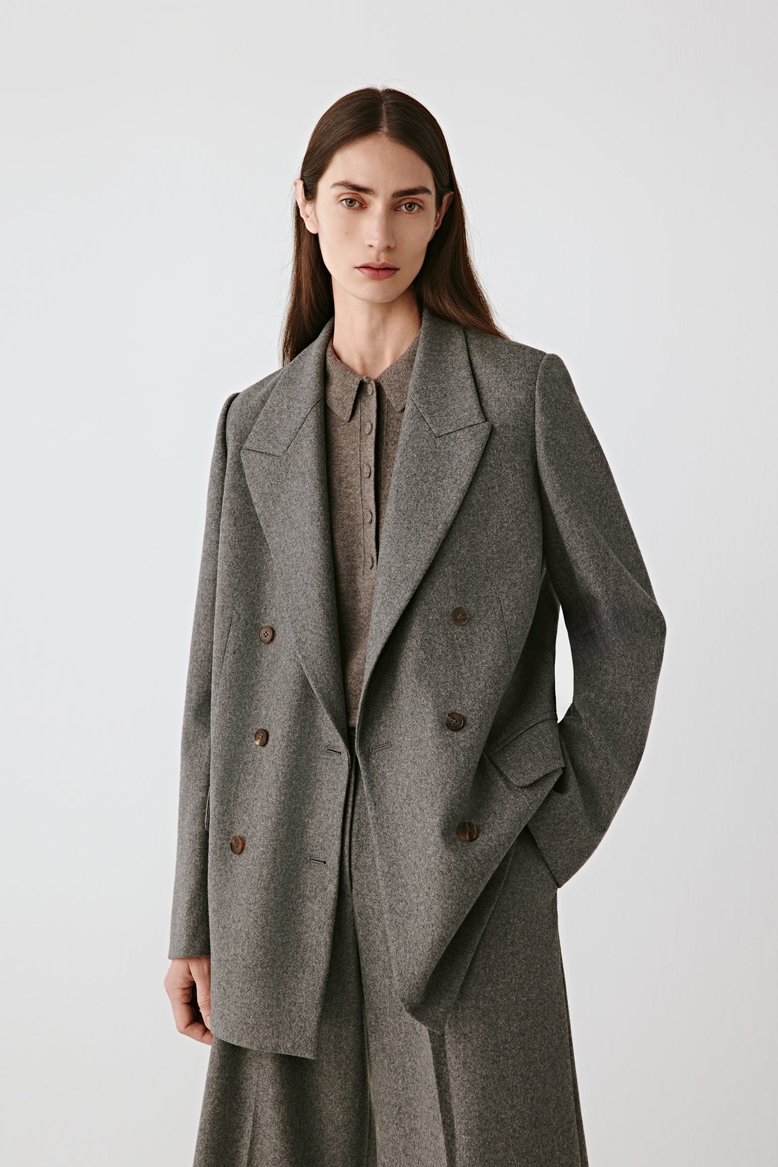 Front view of the grey melange double-breasted blazer showing clean tailored lines.