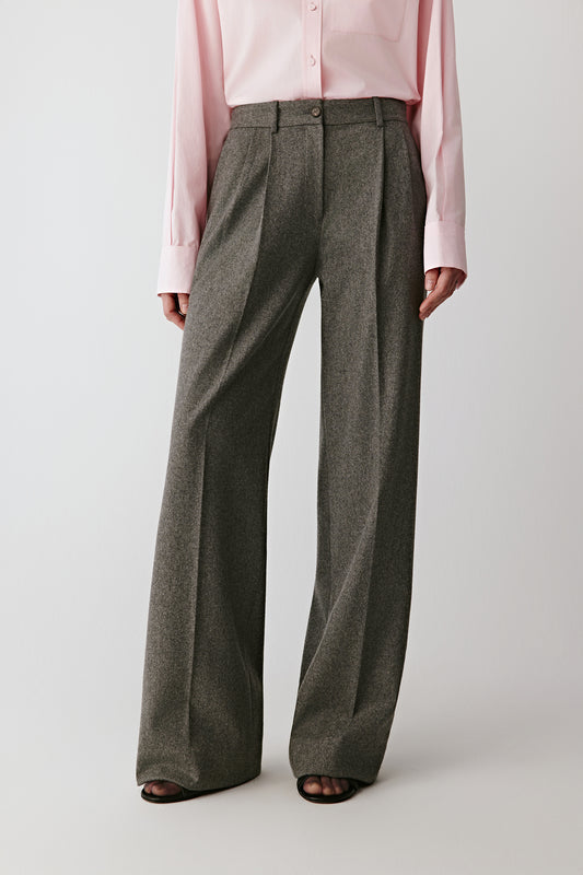 Front view of the grey melange wool and silk wide-leg trousers, pleated front with a fluid drape.