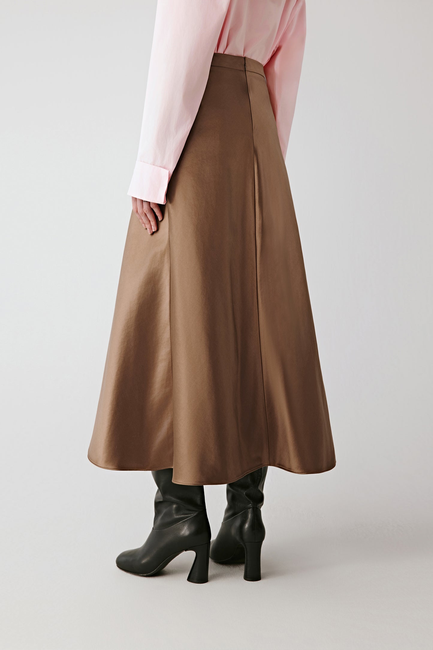Side view highlighting the fluid movement and subtle volume of the skirt.