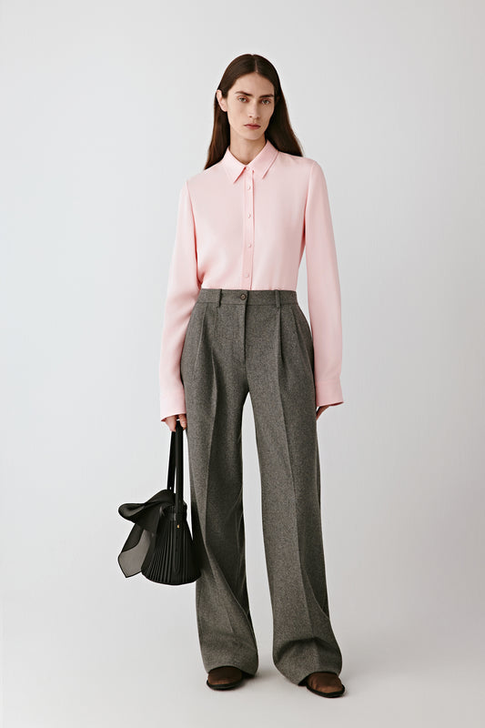 Front view of the grey melange wool and silk wide-leg trousers, pleated front with a fluid drape.