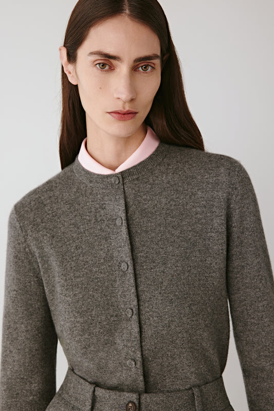 Portrait close-up of the crew neck and fine-gauge knit texture.