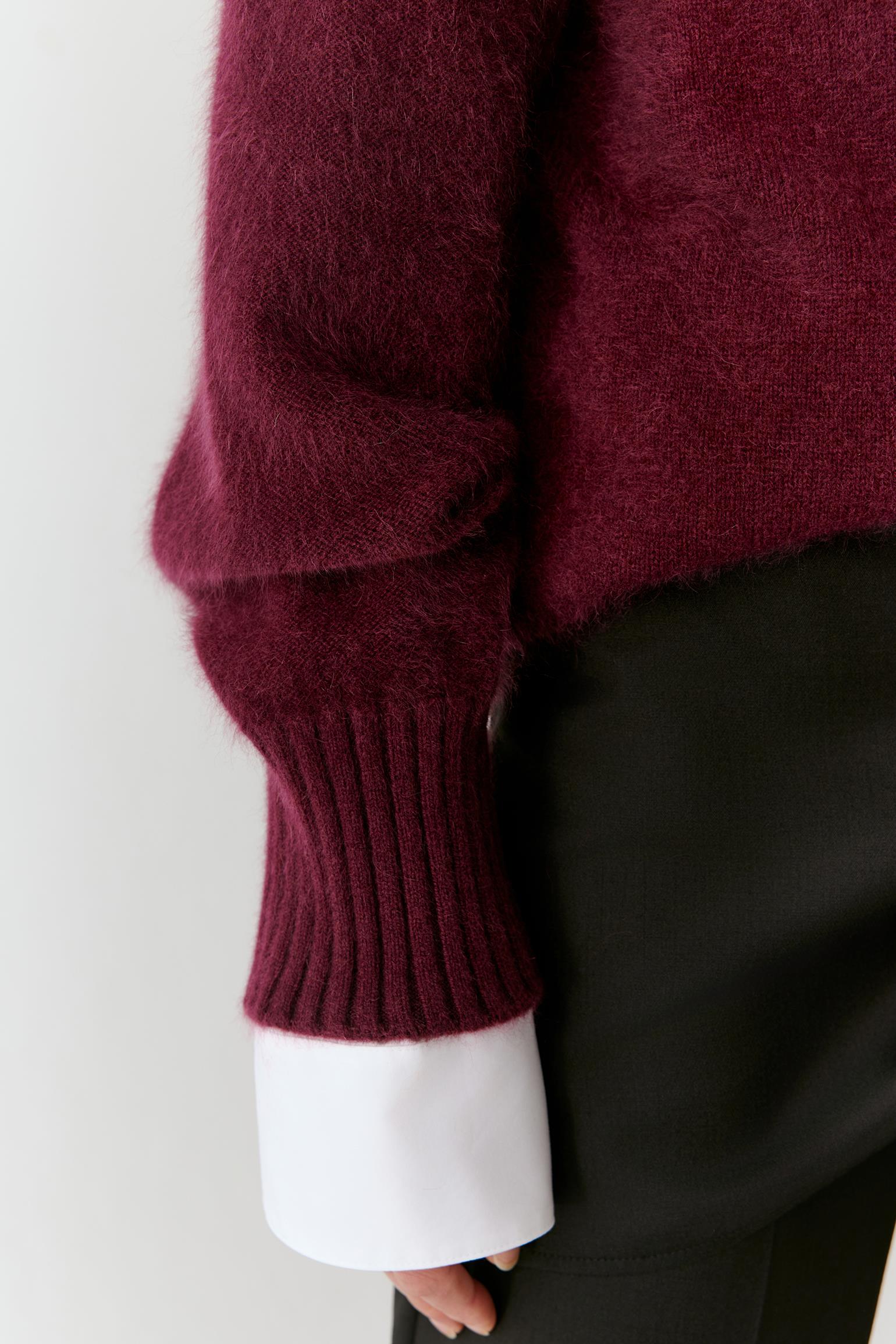 Close-up of the sleeve and cuff, highlighting the ribbed finish and soft cashmere texture.