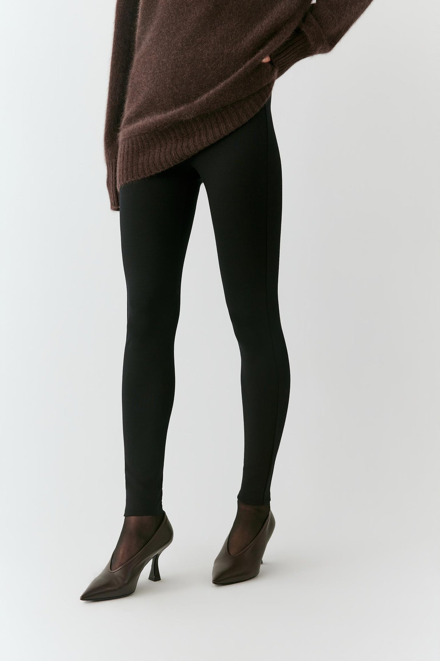 Closer front view highlighting the slim fit and smooth surface of the wool jersey.