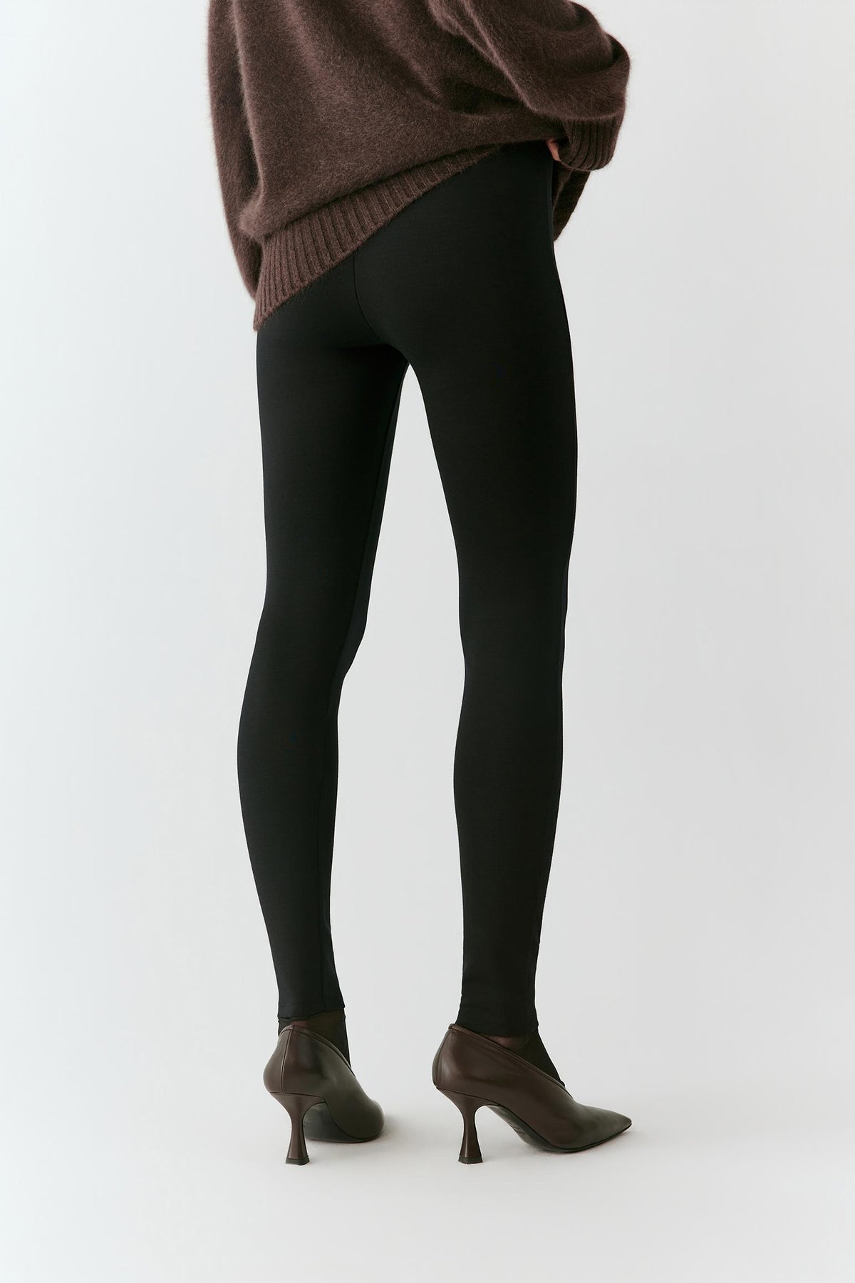 Three-quarter view highlighting the slim leg and streamlined fit.