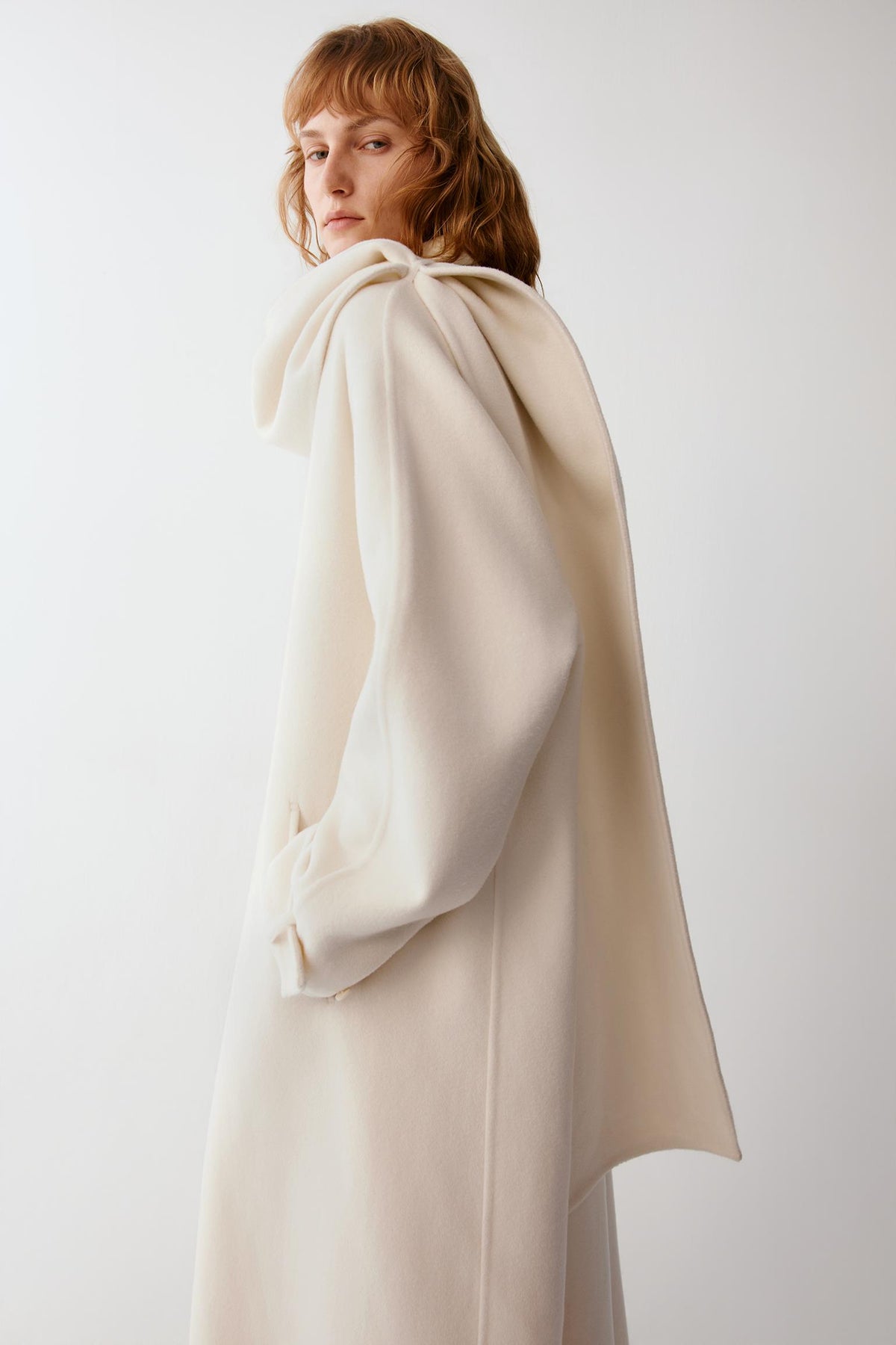 Three-quarter back view showing the structured construction and smooth surface of the wool and cashmere blend.