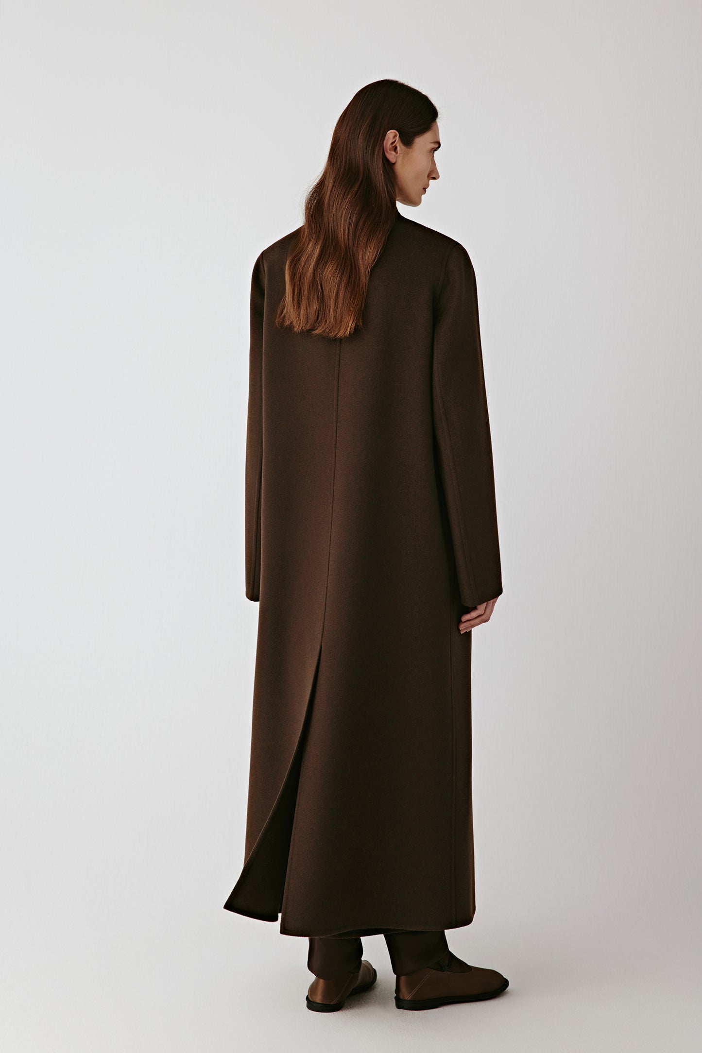 Back view showing the elongated shape and elegant fall of the material.