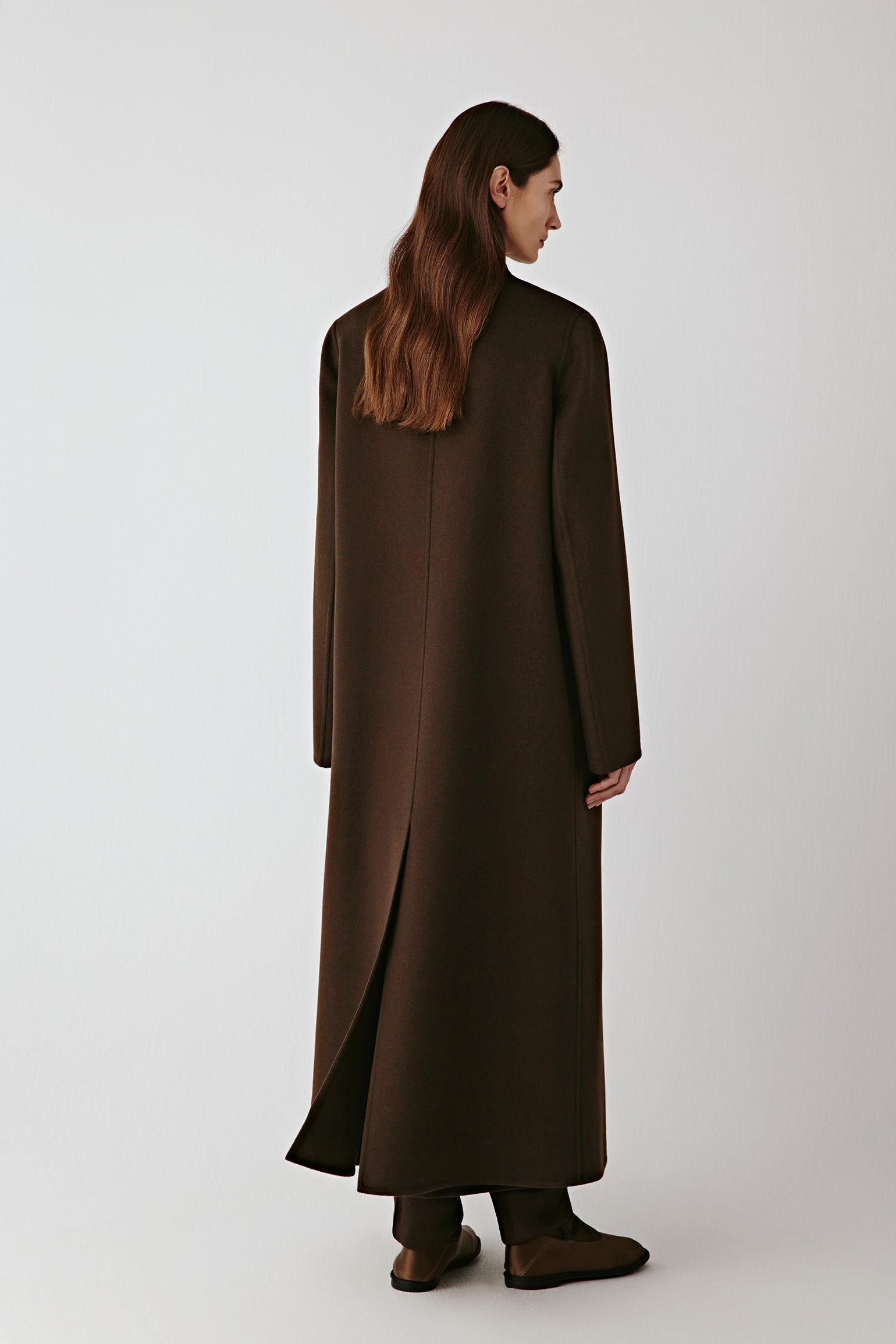 Back view showing the elongated shape and elegant fall of the material.