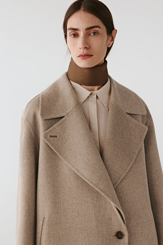 Portrait view showing the wide notched collar and soft texture.