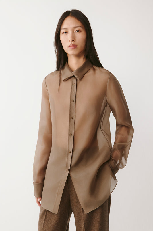 Three-quarter view highlighting the sheer fabric and natural drape.