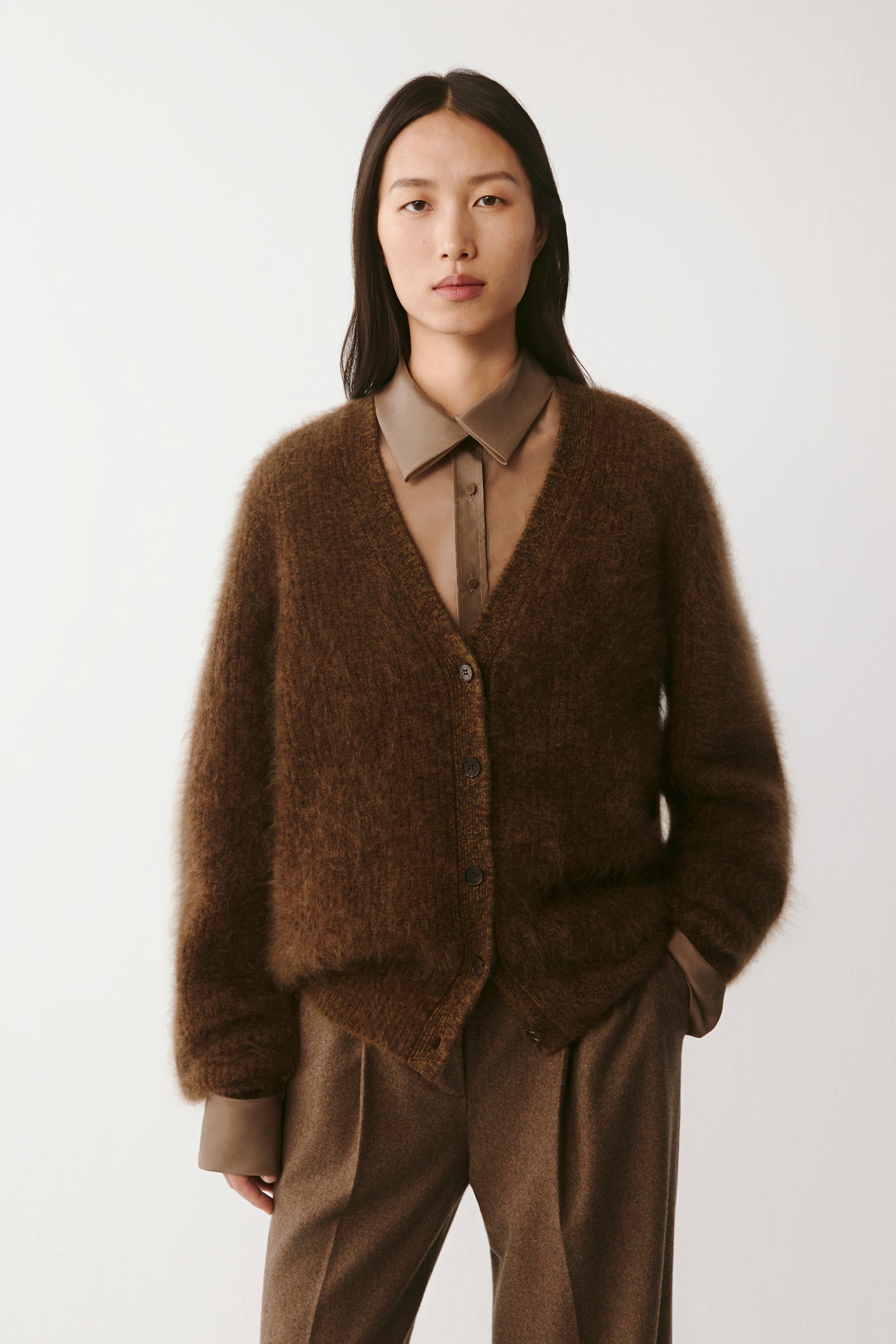 Three-quarter front view showing the cardigan’s relaxed fit and soft texture.